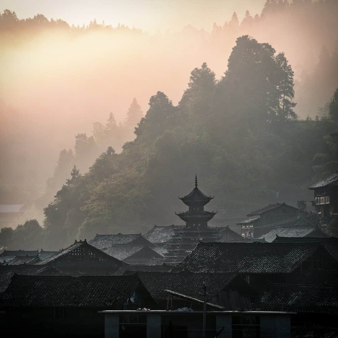 National Geographic Travelさんのインスタグラム写真 - (National Geographic TravelInstagram)「Photo by @Justin.Jin / Shielded from the rest of China’s rapid development by a cascade of steep mountains, this hamlet in Guizhou Province has kept its ethnic minority traditions and arts from centuries ago. With a history that goes back to the Tang dynasty, the village in Maogong county is adorned with bell towers and beautiful old houses. Yet highways and tunnels are plowing through these mountains, putting the future of the village’s past at a crossroads.  Follow @justin.jin for more stories and images from around the world. #china #guizhou #tradition #justinjin」12月7日 16時40分 - natgeotravel