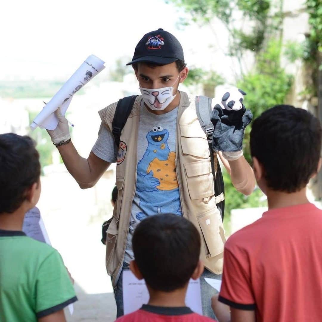 unicefさんのインスタグラム写真 - (unicefInstagram)「“Children here have already been through so much and they still lack basic services. The last thing they needed was to be forced to be away from school and friends.” 22-year-old Osama is part of a team of UNICEF-supported volunteers providing education for young people affected by conflict and COVID-19 school closures in Homs, Syria. ⠀ ⠀ His team writes stories, composes songs and creates fun activities, all centred around child rights, COVID-19 prevention and mine risk education. ⠀ ⠀ “I’m overwhelmed to see how happy children and parents are with what we are doing. We’ve succeeded in helping ease some of the pressure they’re under.” ⠀ ⠀ With the help of dedicated staff, volunteers and partners, UNICEF aims to reach 93.3 million children in emergencies with education next year.⠀ ⠀ Find out more by tapping the link in our bio.⠀ ⠀ © UNICEF/UNI345341/Aldroubi」12月8日 1時45分 - unicef