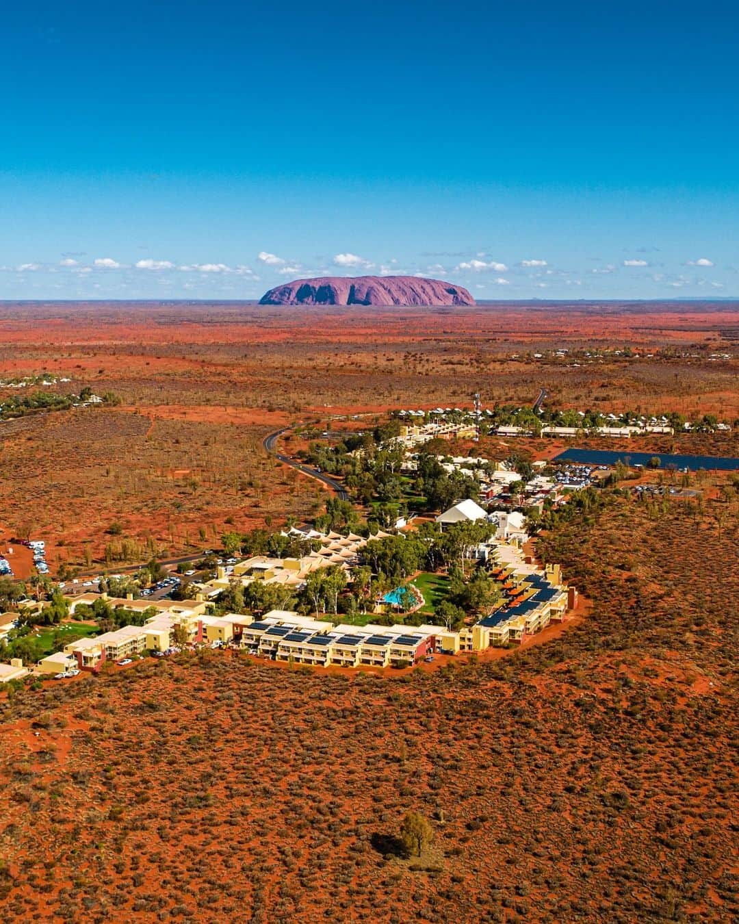 Australiaさんのインスタグラム写真 - (AustraliaInstagram)「@ExploreUluru, don’t mind if we do! 😍 😎 This amazing shot by @iamsavi of #AyersRockResort in the @ntaustralia is postcard perfect, wouldn't you agree? Set against the iconic backdrop of @seeuluru, this is a fabulous spot to base yourself on a @visitcentralaus adventure. Wake up early and take a sunrise #DesertAwakenings tour of Uluru, or get an entirely different perspective and marvel at it from the sky with @ayersrockhelicopters or @ayersrockscenicflights. Then, spend your evening dining under the stars with the incredible #SoundsofSilence experience complete with traditional Australian #bushtucker. #seeaustralia #NTaustralia #RedCentreNT #SeeUluru #exploreuluru #holidayherethisyear」12月8日 4時00分 - australia