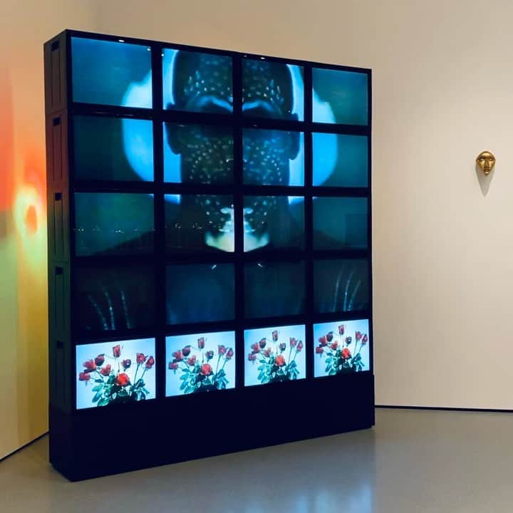 ニューヨーク近代美術館のインスタグラム：「#TheoEshetu's "Till Death Us Do Part" consists of five episodic videos shown on a grid of 20 television screens. The Berlin-based, British-Ethiopian artist's pioneering video work explores the burgeoning media culture of the 1980s and its impact on race and identity at that time.  “We felt marginalized and outside of a system that didn’t acknowledge our existence,” Eshetu recently reflected. “It became our ‘project’ to find ways of expressing ourselves in an attempt to integrate with a system that didn’t include us.”  Meet the artist on our Instagram Live this Wednesday at 12pm EST, when @theoeshetu joins curator @smoothugochukwuc for our Drop In discussion series.   Experience the recently resuscitated installation, which was out of circulation for 32 years, in our new second-floor collection gallery, The Sum of All Parts.」