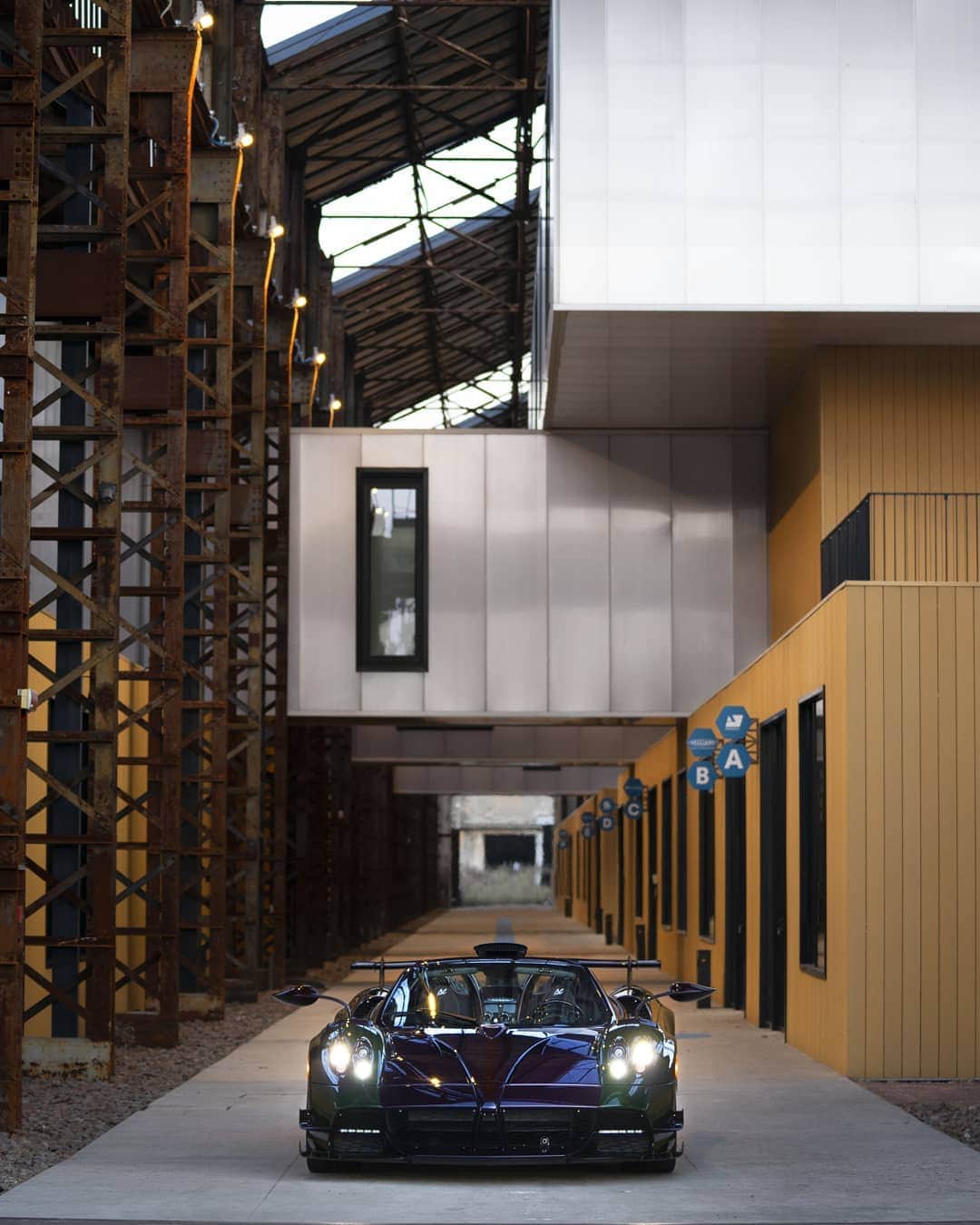 パガーニ・アウトモビリのインスタグラム：「The ideal setting for this specimen of Roadster BC.  It was once a key piece in the Italian industry, today the @parco_innovazione is a prime example of urban regeneration, but also an open air gallery to see some amazing works of street art and land art.   #pagani #huayra #roadaterbc #ParcoInnovazione」