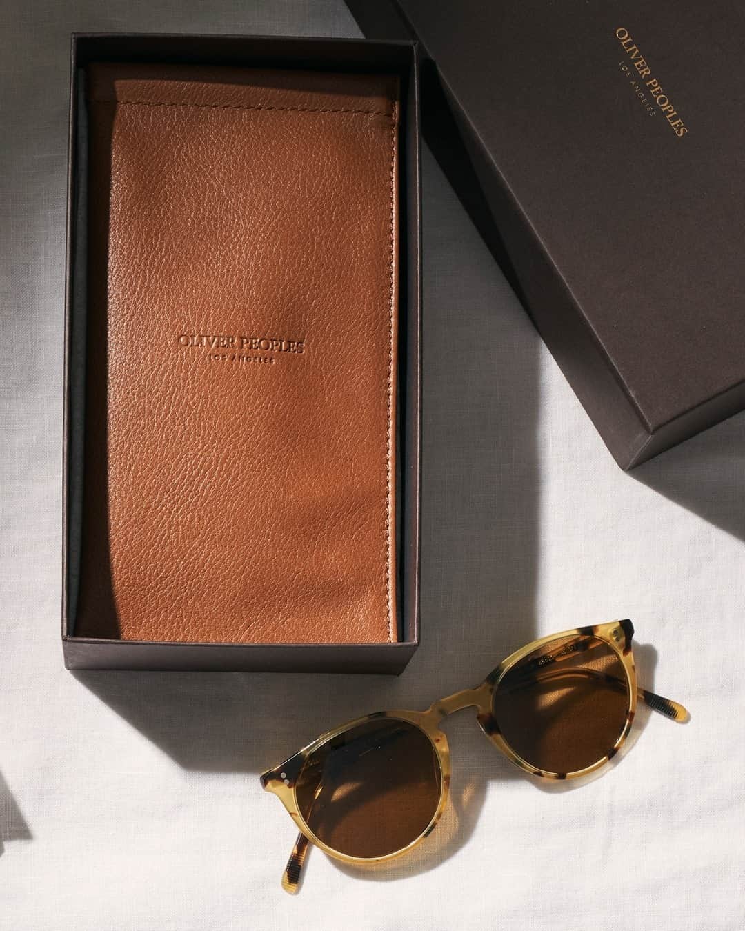 のインスタグラム：「Our new genuine leather cases are available in three sizes for frames, clips, and foldable frames, and a variety of colors. Match your frame with a leather case for the perfect gift set.」