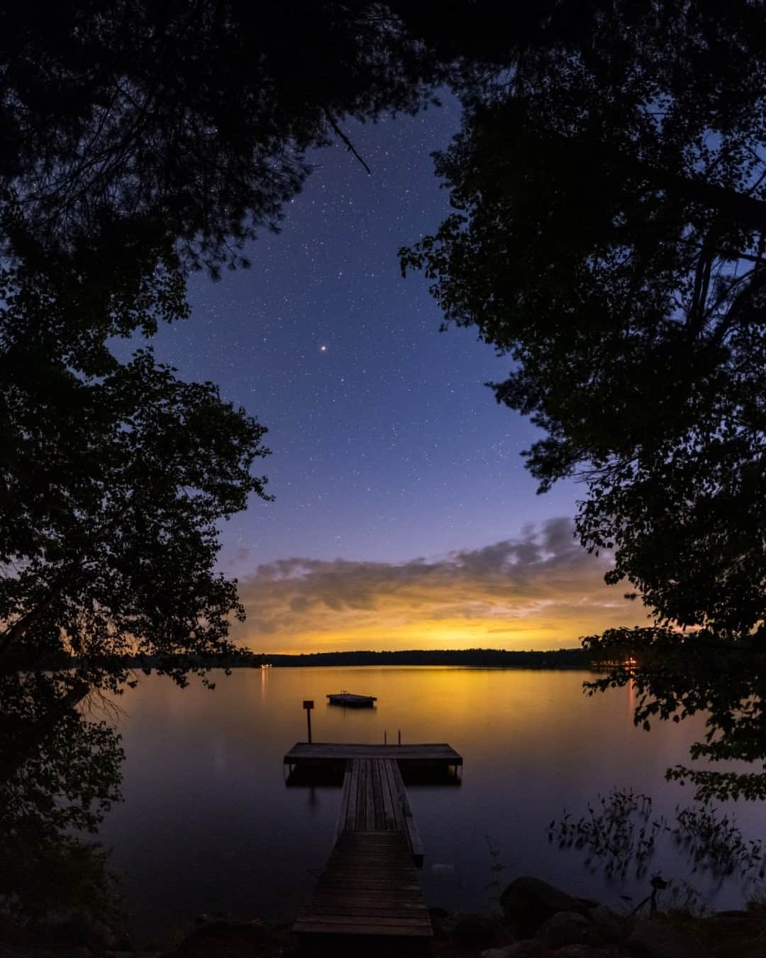 National Geographic Travelさんのインスタグラム写真 - (National Geographic TravelInstagram)「Photo by @babaktafreshi / On a summer evening in Maine, stars appeared in the sky over this lake as the light of a nearby town reflected off the clouds on the horizon. There is nothing as peaceful as the transition of day to a natural night, far from artificial lights. Explore more of the world at night photography @babaktafreshi. #twanight #stargazing #maine」12月11日 2時33分 - natgeotravel