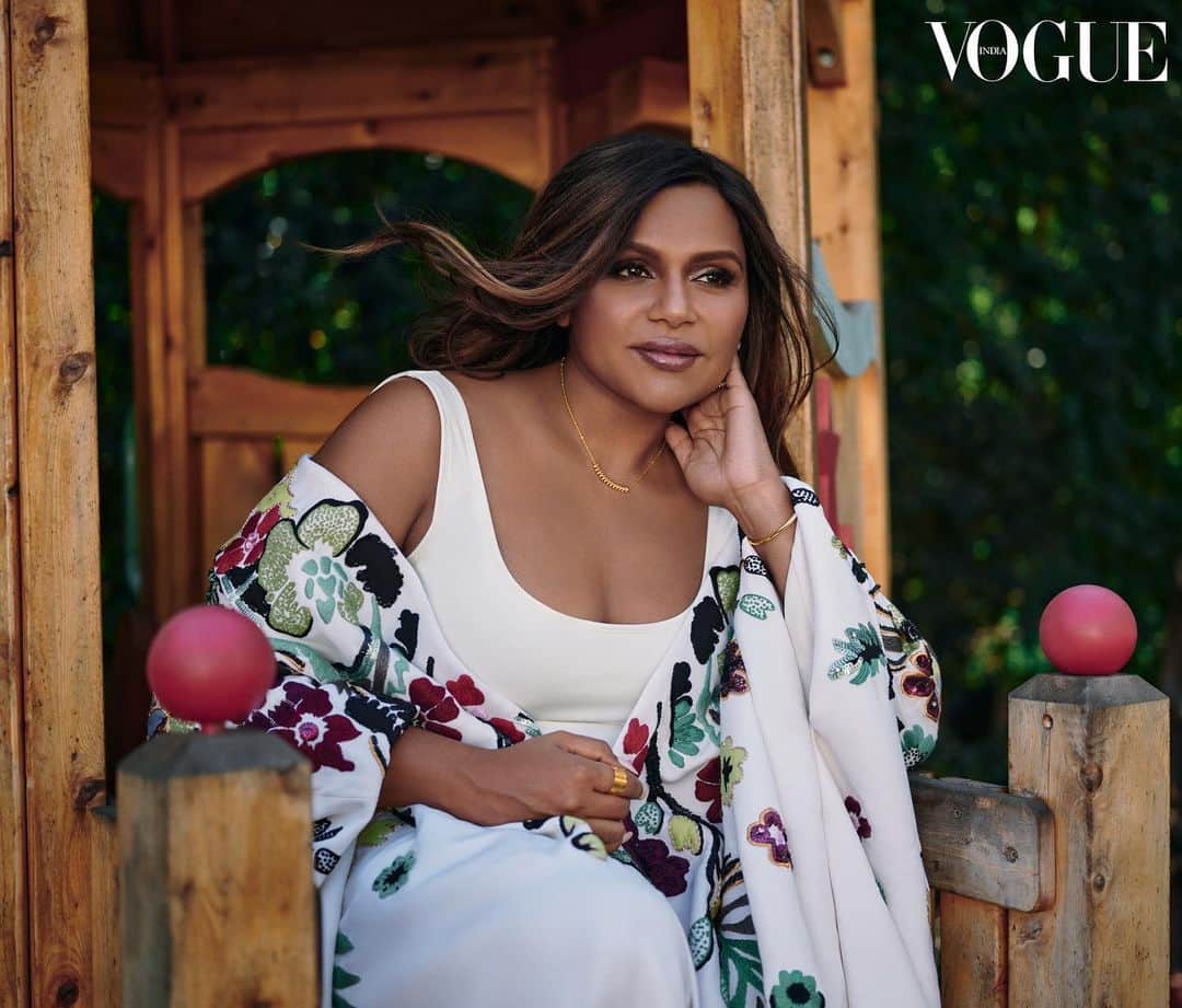 ミンディ・カリングのインスタグラム：「Believe it or not, we shot my entire @vogueindia cover in my backyard, mostly while my daughter was napping. That’s why I’m posing on her play structure in a @maisonvalentino caftan. You know, normal stuff.」