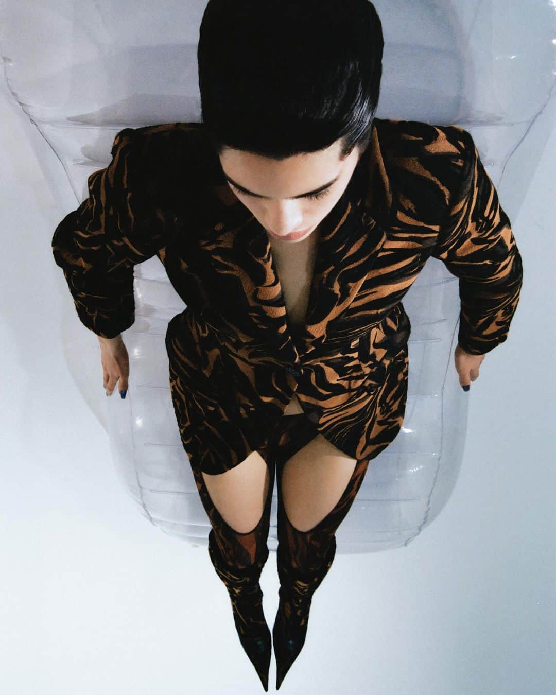 ミュグレーのインスタグラム：「The tiger print jacquard jacket with matching hosiery and boots from the MUGLER Fall Winter 2020 collection by @cadwallader featured in the second issue of Pull Letter.  - - Magazine @pullletternyc  Photographer @fred.gasi  Stylist @louis_portejoie  #mugler」
