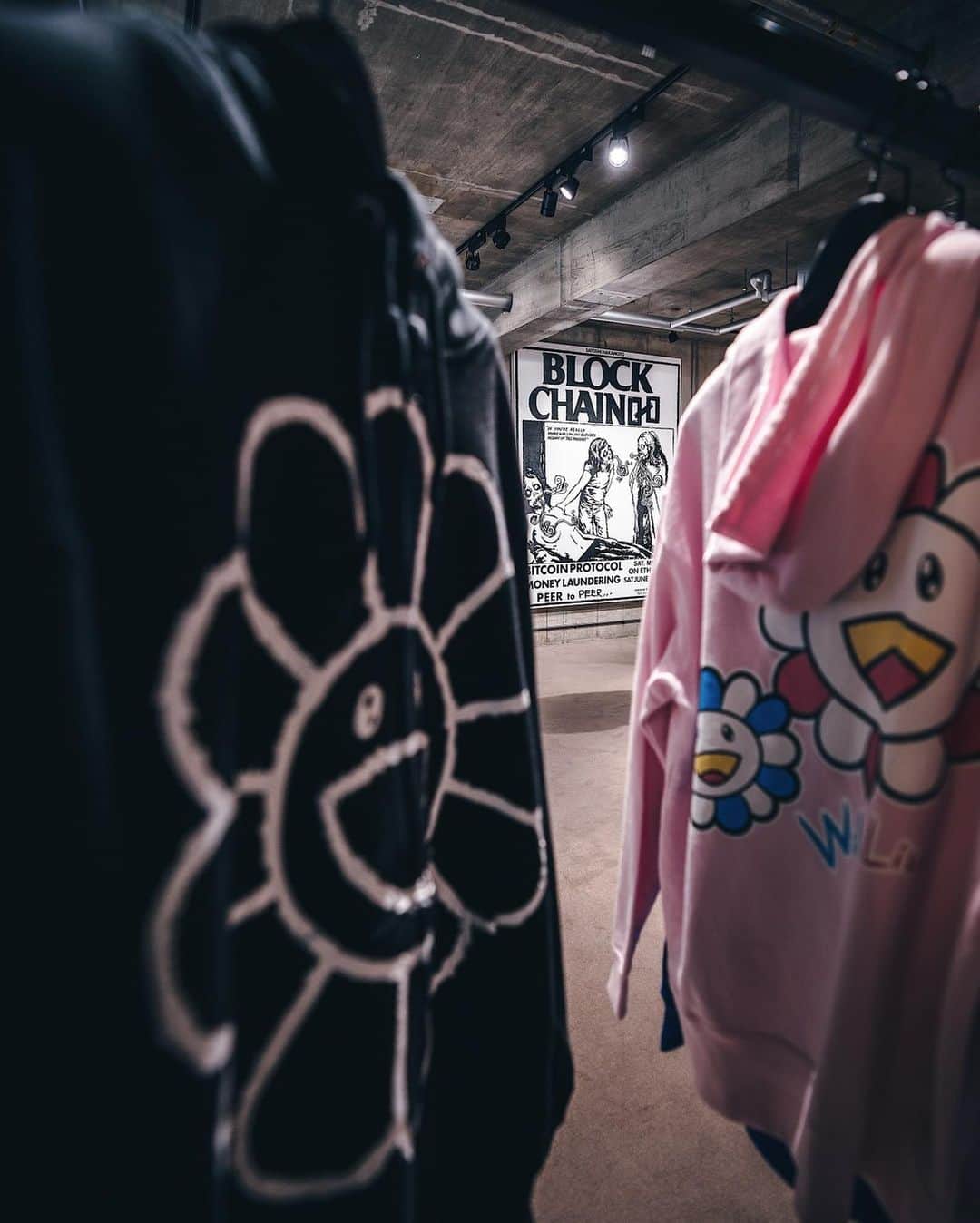 村上隆さんのインスタグラム写真 - (村上隆Instagram)「My new clothing line at Cherry Fukuoka @cherry__fukuoka masks and other items. The highlight of the release was the installation of the products along with my 3-meter-high large painting, BLOCKCHAIN. I first met Cherry @_________cherry_______ through Instagram and we have since been constantly discussing and contemplating fashion together. This time around, once again, I had so much fun developing the various products in tandem with him. The part of my brain that’s completely different from that with which I think about and produce art got activated, making me feel fresh. This kind of release may be the right approach that would allow me to get closer to the audience in Asia. I’m starting to think about releasing items in Tokyo as well.  The event in Fukuoka is on-going until December 25, so if you happen to be in the city, please make sure to stop by! photo: @rkrkrk  translation: @tabi_the_fat   チェリー福岡　@cherry__fukuoka で僕の新しい服のライン 「CONTeXT」 @context_takashipom の服やマスク、他のリリースのキャンペーンで、福岡に行って来た。白眉なのは高さ3mの大作絵画「ブロック・チェーン」のペインティングの展示とフーディー、クルーネック、マスク、版画等のインスタレーションだ。チェリーさん　@_________cherry_______ とはInstagramを通じて知り合って、ずっとファッションの事を考えたり話し合ったりさせてもらう仲間だ。今回も彼とガッツリ組み合っての商品開発はめちゃくちゃ楽しかった。アートを思考し制作する脳味噌とは全く違った部位が起動して、フレッシュな気持ちになれる。この方向での発表はアジアではオーディエンスに接近できるアプローテでは無いかと思う。東京でもやってみようかなぁ、とか、考え始めてます。イベントは12月の25日迄開催なので、福岡に立ち寄る方は是非ともお店、覗いて見てください。」12月12日 4時49分 - takashipom