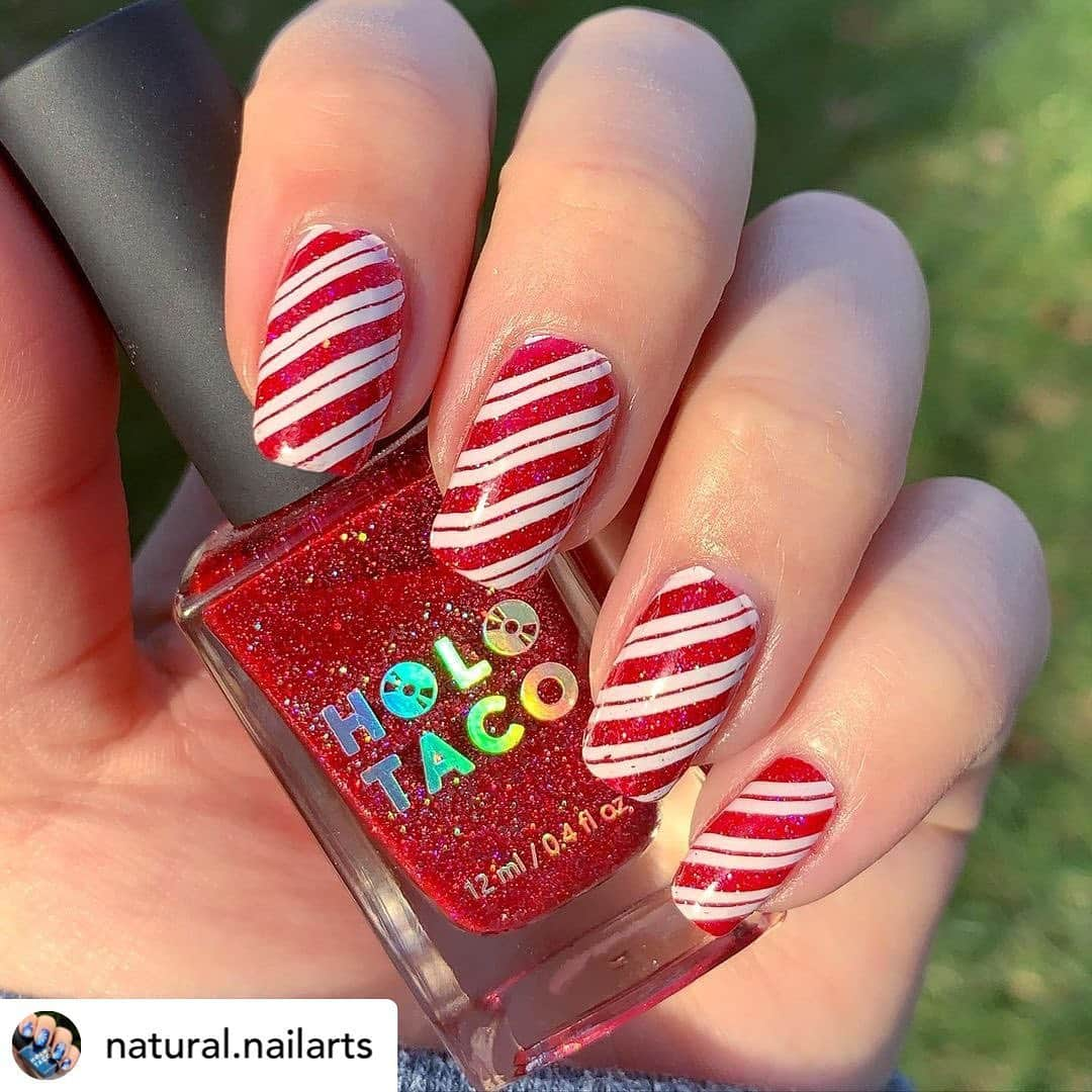 Nail Designsさんのインスタグラム写真 - (Nail DesignsInstagram)「Credit • @natural.nailarts Let Holoday manis begin!!! My first festive design this winter is a candy cane look for #holotacoholodays2020  and #glamnailschallengedec this is as much sun as I could get this morning to make the holo sparkle 🤣. . . . @holotaco Party Punch. . @uberchicbeauty stamping plate.  . .  . ~Code NATURALLYNAILS for 10% off at Maniology.com~. ~NATURAX10 for 10% off at Beautybigbang.com~. ~ELIZ for 10% off at Rossinails.com~ . . . #nails #nailsnailsnails #manicure #naildesigns #nailsonfleek #naildesign #nailartjunkie #nailart #nailsoftheday #nailsofinstagram #nailsofinsta #nailpolish #nailpolishaddict #nailpolishlover #nails2inpire #nails2020 #prettynails #nailedit #naillife #nailporn #cutenails #naillove #nailartlover #nailartchallenge #nailspafeature #holotaco」12月12日 5時39分 - nailartfeature