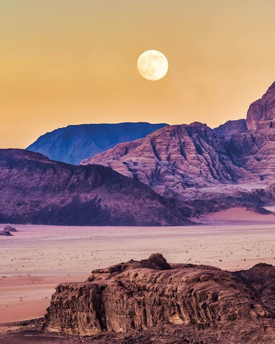 Lonely Planetのインスタグラム：「Do gorgeous images inspire the photographer in you?   “This shot was taken while on a camel trek across Wadi Rum. Each morning we’d wake before dawn and ride out into the desert to shoot various scenes. As a landscape photographer, something I’m always aware of when scheduling a shoot is to do it either during a full moon or a new moon. The latter is perfect for night sky shots of the Milky Way, while the former enables a dramatic shot such as this.”   📷 Tom Mackie  Be sure to add this book to your Christmas list and visit the link in our bio to order it.」