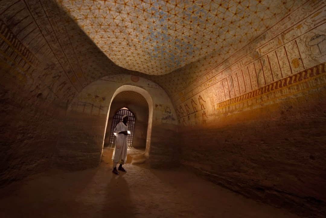 National Geographic Travelさんのインスタグラム写真 - (National Geographic TravelInstagram)「Photo by Robbie Shone @shonephoto / The tomb of the Nubian King Tantamani (Tawentamani) at El Kurru, Sudan, is decorated with hieroglyphic inscriptions and images of the pharaoh and the gods. Uncle Ali, the key holder, illuminated part of the wall for us. The tomb was originally excavated in rock under pyramids that are now partially collapsed.」12月12日 20時38分 - natgeotravel
