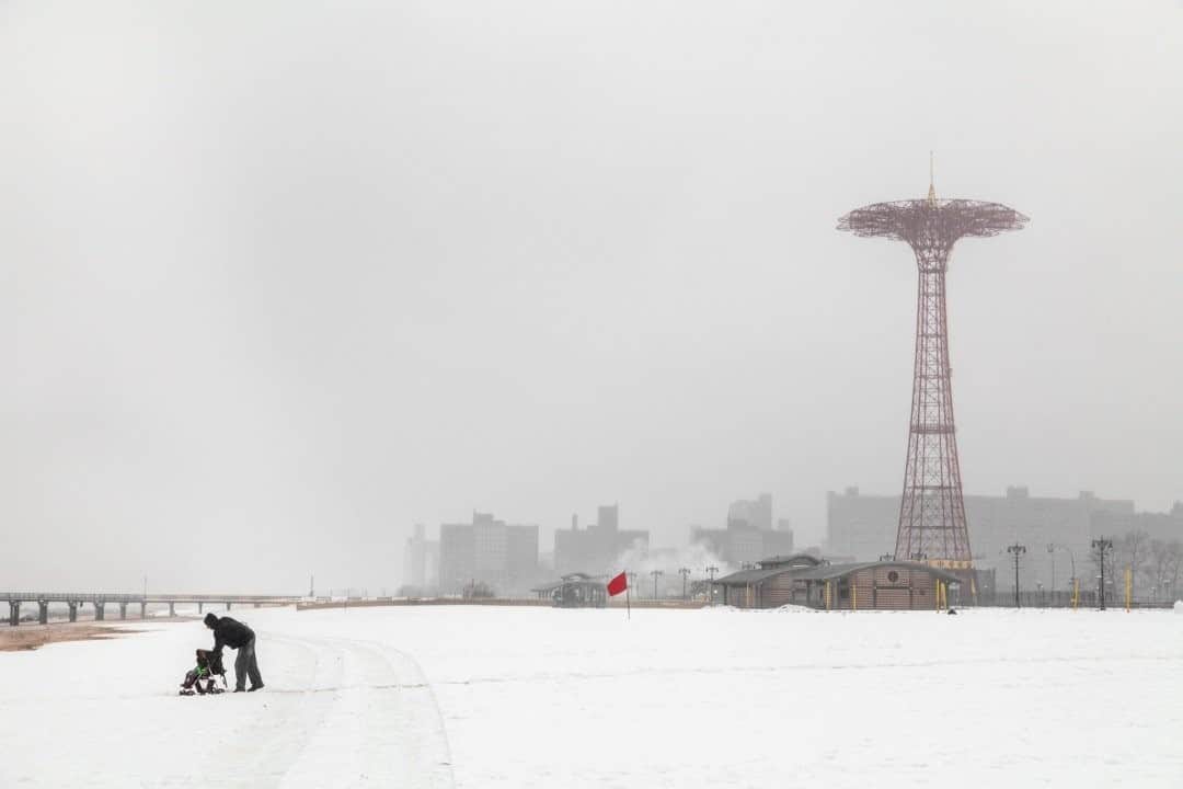 National Geographic Travelさんのインスタグラム写真 - (National Geographic TravelInstagram)「Photo by @juancristobalcobo / The beach at Coney Island covered with snow already seemed to be an extraordinary sight, but then a man and a baby stroller entered the scene, making it a bit surreal. #coneyisland #snow #juancristobalcobo」12月13日 8時35分 - natgeotravel