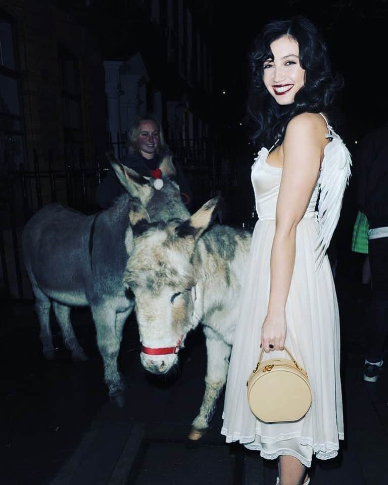 のインスタグラム：「Flicking through old photos of Christmas parties over the years.... this one from @thelovemagazine party is a particular favourite of mine, @kegrand said I should come as an angel.... I think she was joking but I was happy for the excuse to wear this @halfpennylondon dress and some angel wings! The donkeys were an extra surprise at the door! I hope you’re all feeling festive & finding the joy this Christmas ♥️」