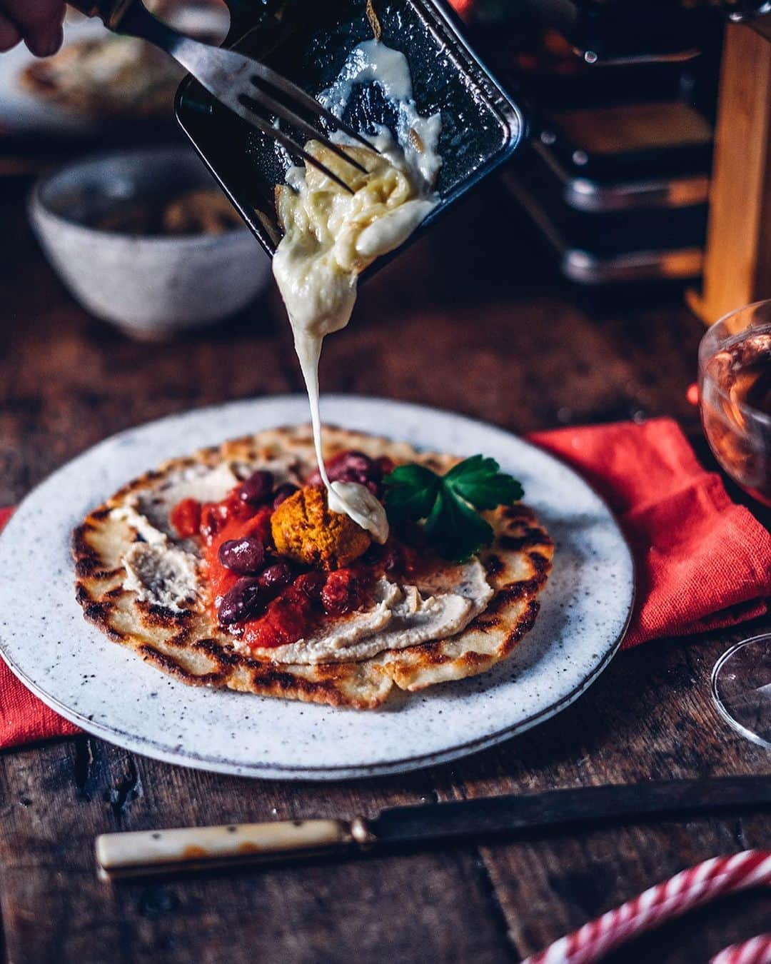 Our Food Storiesさんのインスタグラム写真 - (Our Food StoriesInstagram)「Werbung|Advertisement We had a delicious raclette evening with #lerustique cheese 🧀 🌟 It’s one of our favorite traditions for the winter time. We made gluten-free flatbread, tofu-Brussel sprouts-mushroom skewers, tomato sauce with beans and falafel and added the wonderful Raclette cheese on top. You can find all recipes on the blog. And we have a great GIVE-AWAY for all our German, Austrian and Swiss followers: you can win a raclette grill 🌟 All you have to do is write a comment on the blog, link is in profile. The give-away ends next Sunday (20th of December) and the winner will be drawn by lot. Find all recipes  with #lerustique Raclette cheese on the blog, link is in profile🧀😋 #lerustiquecheese  *This give-away is not sponsored, endorsed or administered by Instagram ____ #christmasmood #christmasdecor #christmasdecorations #gatheringslikethese #fellowmag #simpeljoys #raclette #raclettecheese #foodstyling #foodphotographer #foodbloggers #germanfoodblogger #tabledecor #tablesetting」12月14日 2時00分 - _foodstories_