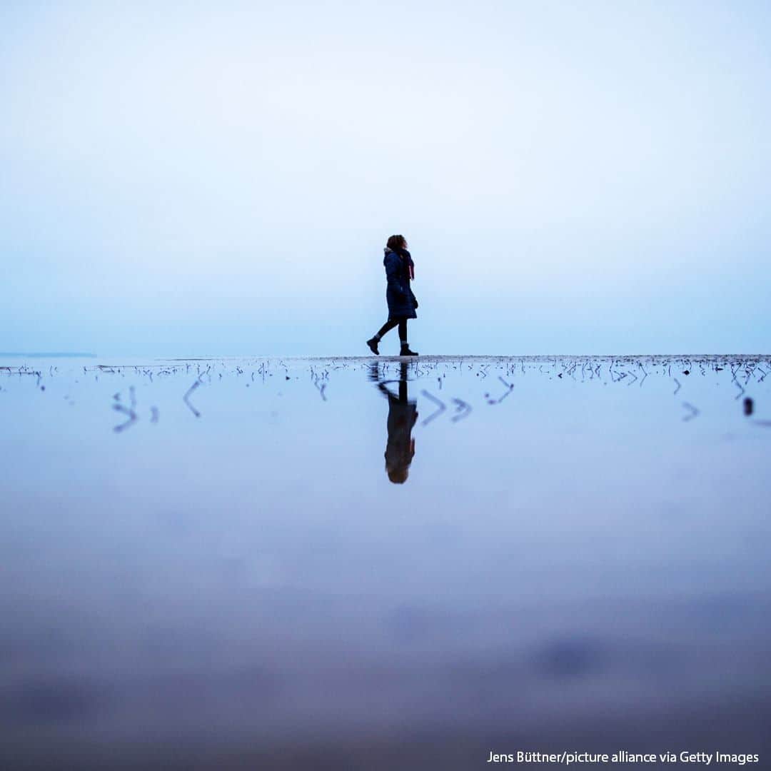 ABC Newsさんのインスタグラム写真 - (ABC NewsInstagram)「A woman walks across a sandbank in wintery weather at Wohlenberger Wieck on the Baltic Sea coast, Northern Germany.  #winter #balticsea #beach #reflectionphotography」12月14日 19時00分 - abcnews