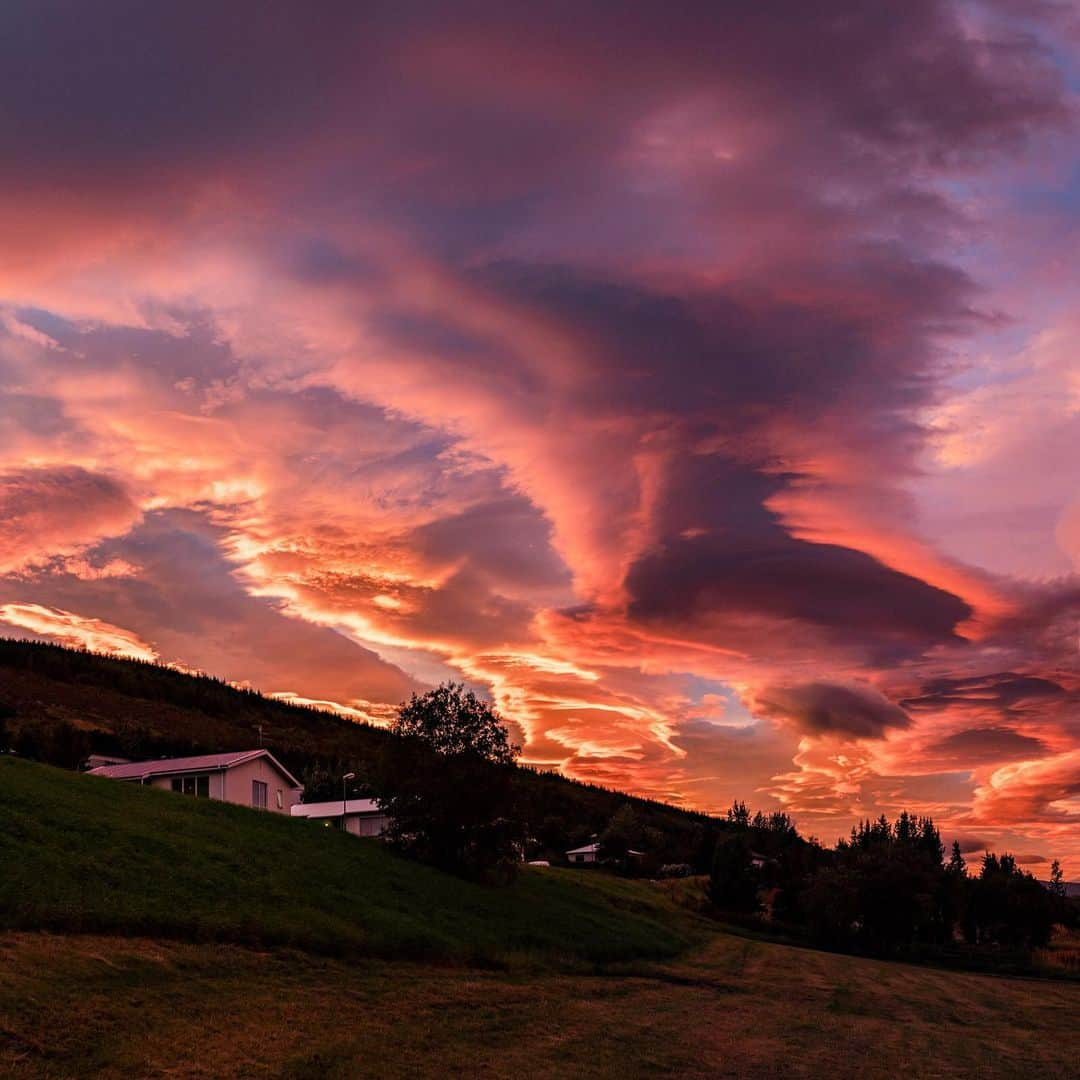 National Geographic Travelさんのインスタグラム写真 - (National Geographic TravelInstagram)「Photo by @babaktafreshi / Slowly swipe to see this panoramic view during an impressive display of lenticular clouds in northern Iceland right after sunset, when rays of light were still reaching these high stationary clouds. Some lenticulars are reported as UFOs due to their flying saucer shape and bright reflection of the setting sun, moonlight, or city lights. Explore more Earth and sky photography with me @babaktafreshi. #sunset #nature #iceland」12月15日 0時35分 - natgeotravel