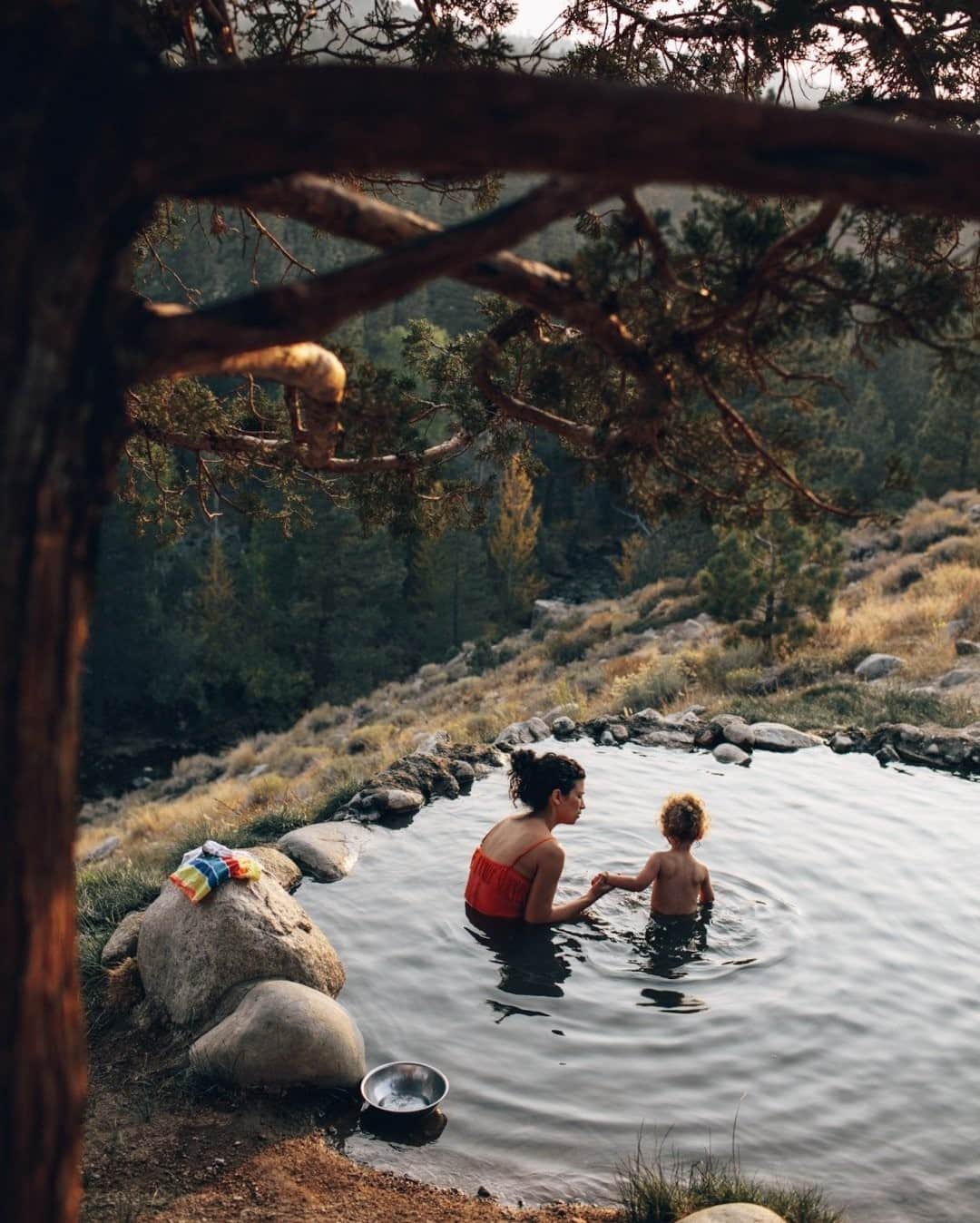 National Geographic Travelさんのインスタグラム写真 - (National Geographic TravelInstagram)「Photo by @joshuacogan / Learning of vast things while holding onto the small ones is what this year has been all about. Treasured moment of my son experiencing his first hot spring in the Sierra Nevada during our summer road trip. For more images of wanderings inward and outward, follow me @joshuacogan. #ourpubliclands」1月13日 12時34分 - natgeotravel