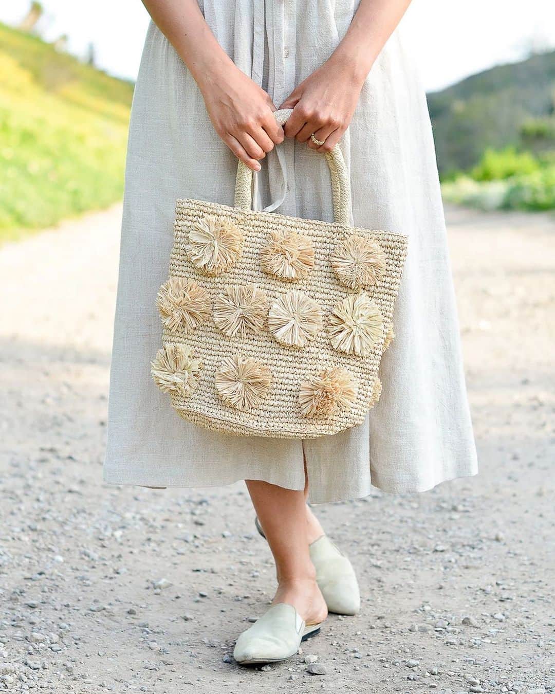 The Little Marketさんのインスタグラム写真 - (The Little MarketInstagram)「Add a dose of pom poms to your winter wardrobe. This hand-woven raffia tote is playful and practical, with cotton lining, an inner slit pocket, and a magnetic closure.  ⠀⠀⠀⠀⠀⠀⠀⠀⠀ Link in bio to shop in two sizes, large and small.」1月11日 4時34分 - thelittlemarket