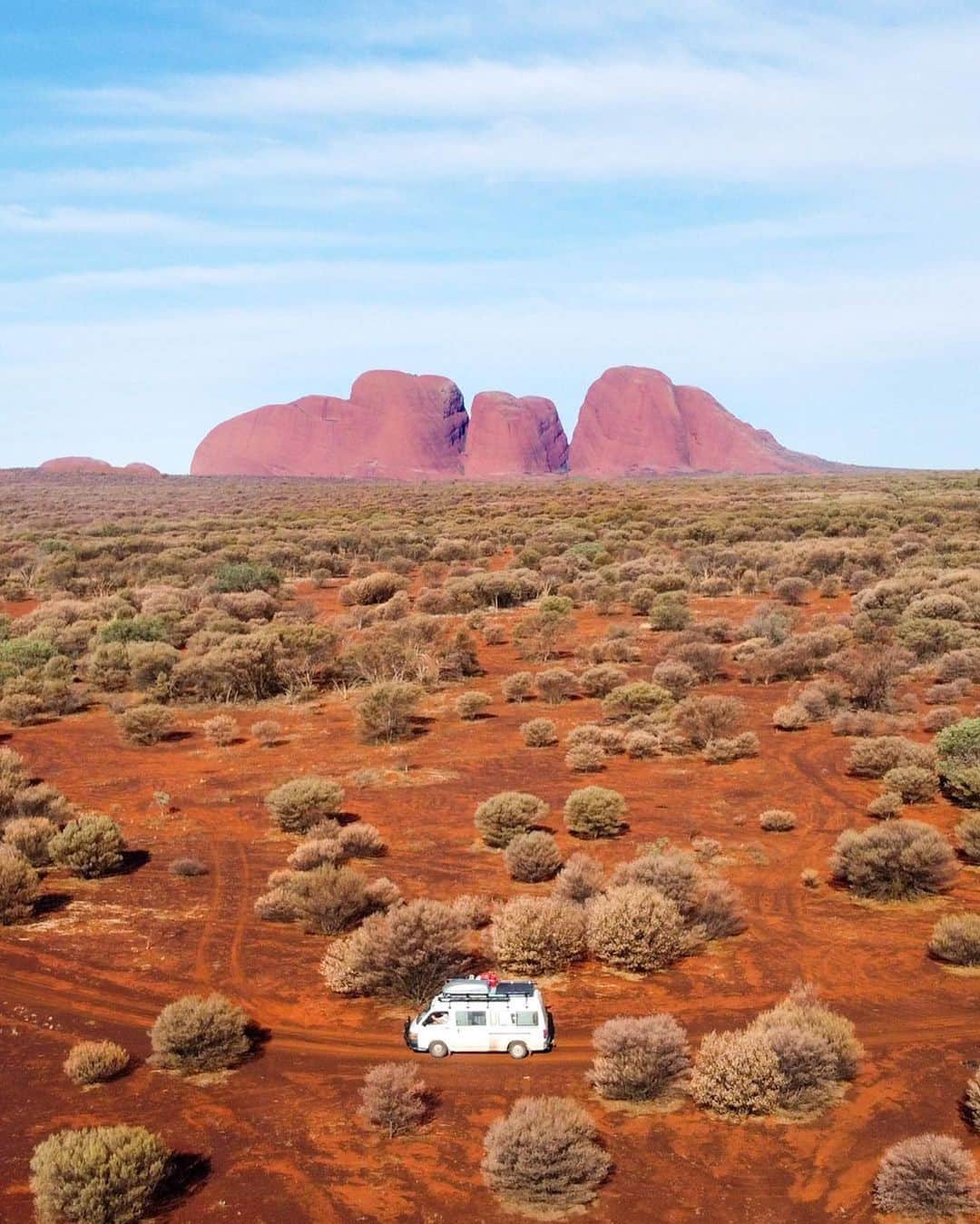 Australiaさんのインスタグラム写真 - (AustraliaInstagram)「Talk about a road trip with a view! 🚗 On their outback adventure, @the.aussie.travellers snapped this shot of #KataTjuta which sits about 30 kilometres away from @seeuluru in @ntaustralia. Hike around the base of these amazing natural wonders on the Valley of the Winds walk, or take a helicopter flight with @ayersrockhelicopters, @professional_helicopters, or @ayersrockscenicflights 🚁 to really appreciate just how large these rock formations are. #seeaustralia #NTaustralia #RedCentreNT #SeeUluru #holidayherethisyear」1月11日 19時00分 - australia