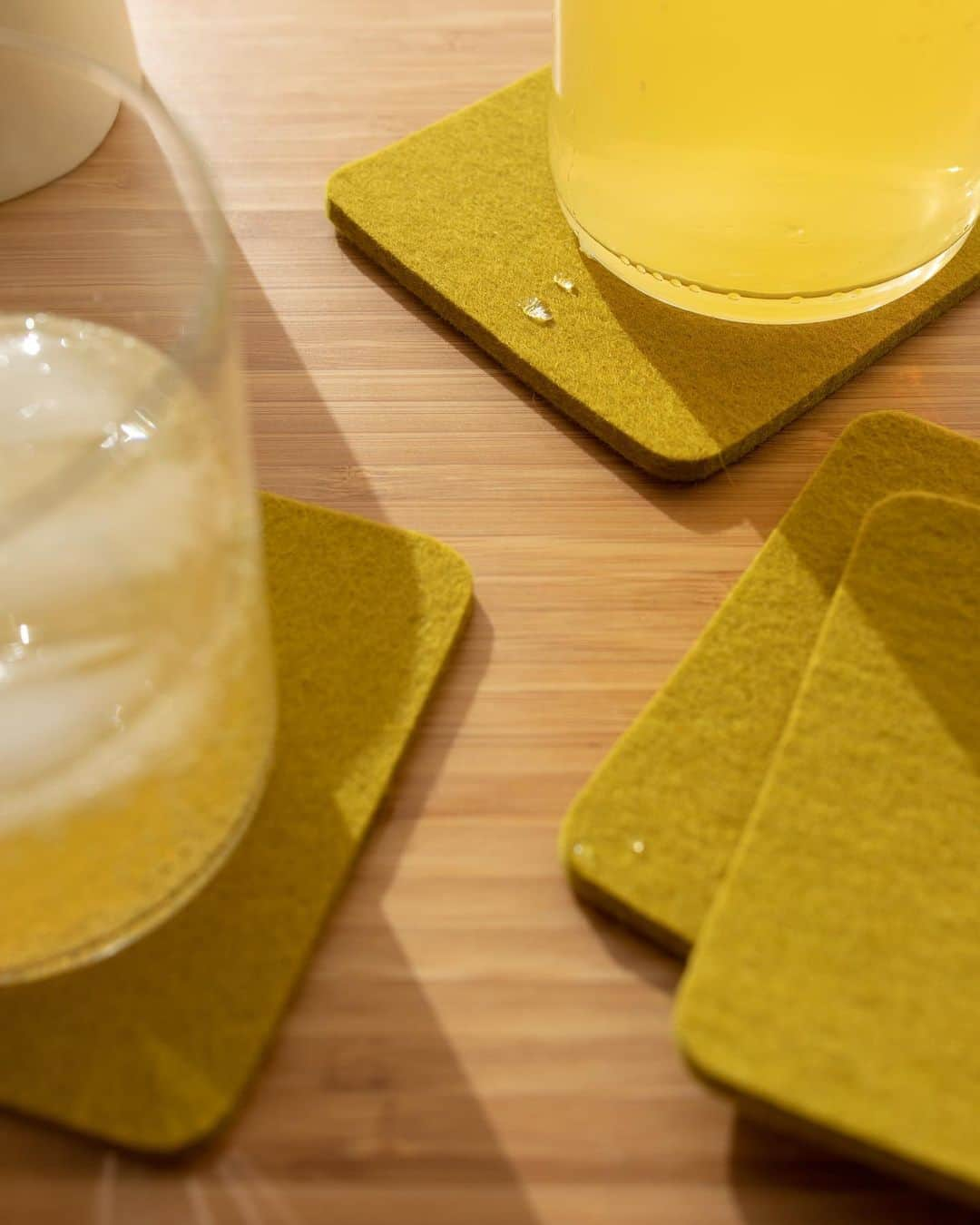 グラフ&ランツのインスタグラム：「Water-wicking and stain resistant, our coasters stand the test of time. Merino wool felt is the most hygroscopic of all natural fibers - keeping your table dry as it repels water. Tap to shop 👆」