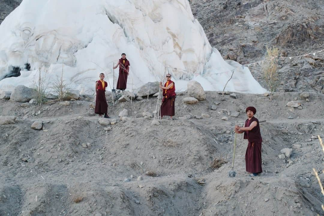 ナショナルジオグラフィックさんのインスタグラム写真 - (ナショナルジオグラフィックInstagram)「Photo by @ciriljazbec / Monks from the Phyang monastery in Ladakh tend willow and poplar trees sustained by meltwater from an ice stupa. The trees are intended to regreen the denuded hillside and stabilize it against erosion. The region had always suffered from droughts, but the situation became more dire with the glacier retreat in the last decades.  Check out Nat Geo's link in bio for more on this story.」1月12日 12時35分 - natgeo