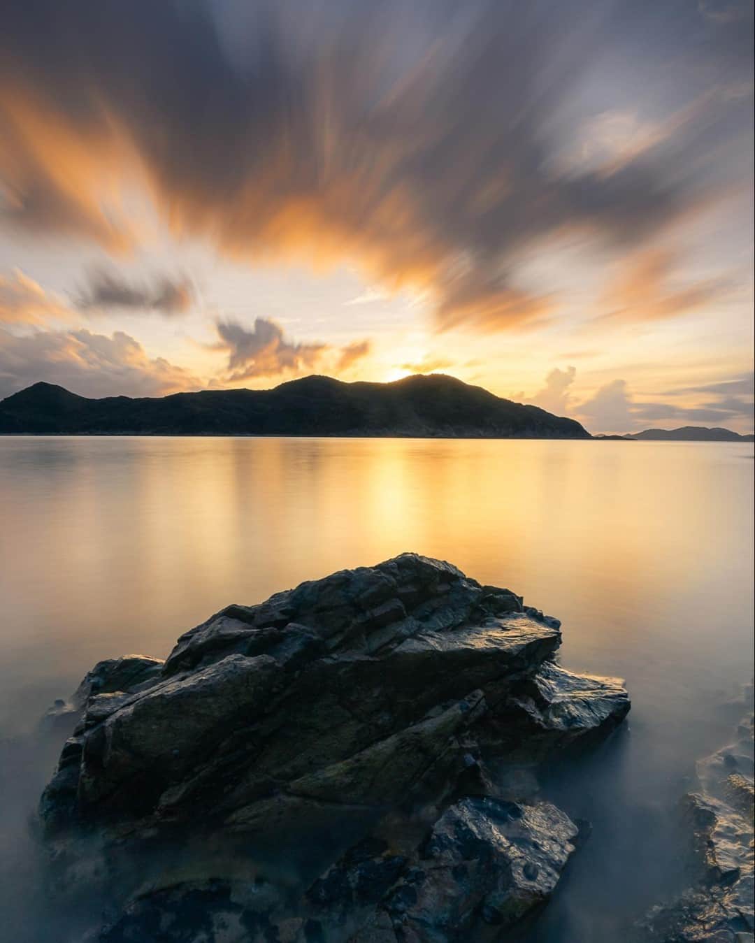 Canon Asiaのインスタグラム：「Chaos and peace - we love the contrast between the moving sky and the smooth-looking water. ⁣ .⁣ @_852.carlo took this photo with the long exposure technique to fully capture the flow of the overhead clouds, coupled with filters and a shutter speed of 60s. The best part? Not knowing what the final shot would look like due to the unpredictability of the moving clouds.⁣ .⁣ 📷 Image by @_852.carlo using the EOS R  EF16-35mm f/4L IS USM  f/22  ISO 100  60s  16mm⁣ .⁣ Got a stunning shot of nature you're proud of? Tag them with #canonasia or submit them on My Canon Story, link in bio!⁣ .⁣ #canonasia #photography #explore #nature #motion #motionblur #movement #landscape #canon #sunrays #composition #sky #canon #lens #inspiration #subject #light」