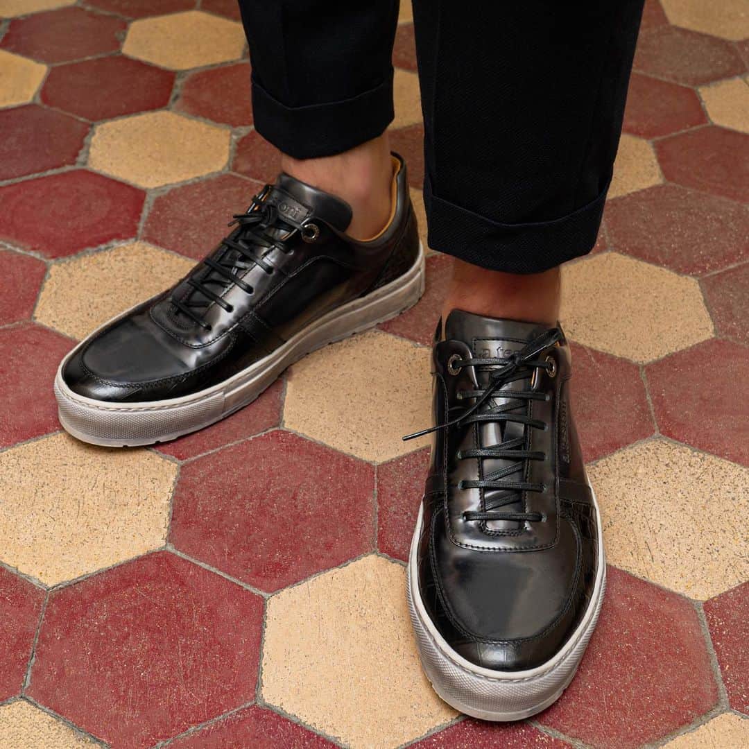 のインスタグラム：「Be ready to dive into a new concept of gentleman sneakers.   #journeythroughtime #atestoni #fw20 #italiandesign #madeinbolognasince1929 #luxury #luxuryattire #finecraftsmanship #italianshoes #leathersneakers #menshoes #antiquedleather #effortlesselegance」