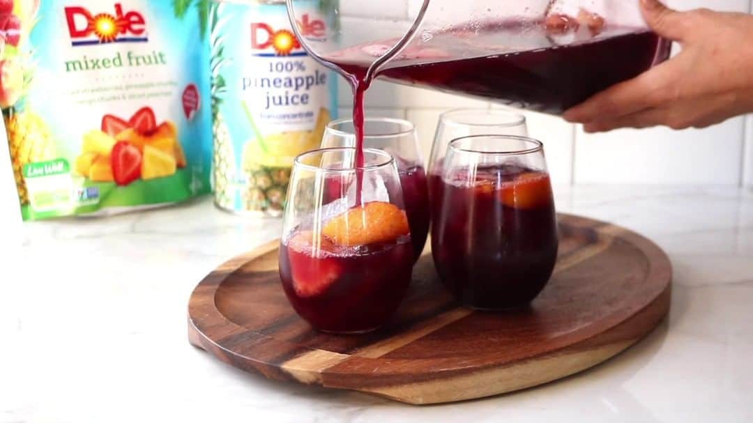 Dole Packaged Foods（ドール）のインスタグラム：「Sip sweetly this holiday season with fruit-forward Holiday Sangria. Wine not indulge a little? 😉   INGREDIENTS:�3 cups frozen DOLE® Mixed Fruit, partially thawed 1/2 cup brandy 2 tablespoons sugar 2 bottles red wine 2 cups DOLE® Canned 100% Pineapple Juice  DIRECTIONS: Place mixed fruit, brandy and sugar in 2 to 3 quart pitcher and stir to combine. Set in refrigerator for 6 to 8 hours. Add wine and pineapple juice; stir to combine. Serve over ice.」