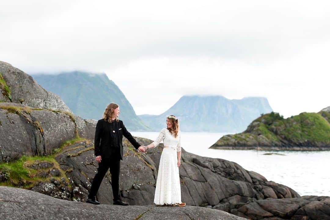 ミナのインスタグラム：「Aline wore our original Indigo dress to her wedding on the island of Senja, Norway. Indigo dress now has a V-neckline and it's made of another leaf patterned lace. It moves beautifully and the big skirt kind of invites you to twirl! Read Aline's wedding story on our blog, link in bio.⁠ ⁠ "Almost desperate to find my wedding dress until I found Indiebride London. I chose the India dress, it was a real dream and Miina is absolutely great! She gives great advice, the service is absolutely professional and warm. The quality and the designs are amazing. I felt just wonderful and completely happy by wearing my dress. Indiebride helped to spread even more magic on our wedding day <3 Aline"⁠ ⁠ Photography: Lena Sørensen⁠ ⁠ ⁠」