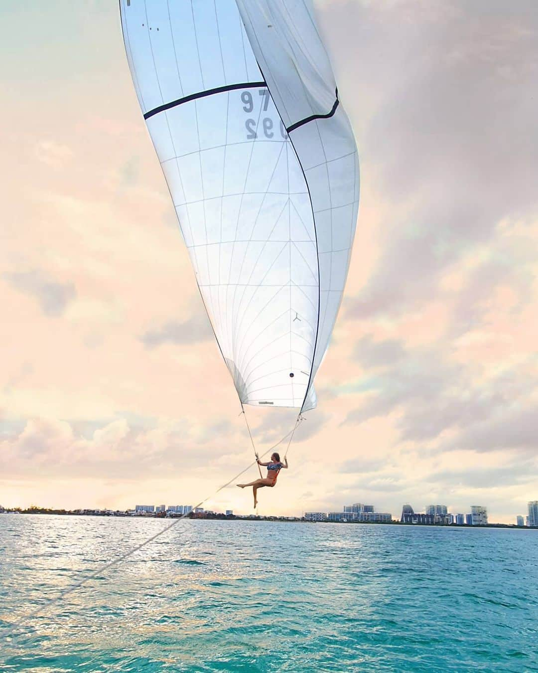 アリサ・ラモスさんのインスタグラム写真 - (アリサ・ラモスInstagram)「Sailing away! ...literally, I'm sitting on the Spinnaker of a catamaran. ⛵ . I also had to jump off of it when it got to about 25 ft up! Of course all I could think about was "Are those bull sharks here too?" 😳🤣 Video coming soon! . This catamaran day trip to Isla Mujeres was actually a lot more fun than I expected! We sailed over from Cancun, and once we got near Isla, the water became a gorgeous koolaid blue! Then we swam to see the underwater museum! My favorite though of course was this Spinnaker thing...bc I'm an adrenaline junky at heart. . Isla Mujeres is also where you can see Whale Sharks between May and August, and they feed there naturally! No hand feeding!  . Will be making a full post of all the fun things to do in Isla soon!  . Would you do the Spinnaker?? . Thanks to Vanessa from Turismo Channel for organizing the catamaran and taking my pics haha! . #adventuretravel #adventures #islamujeres #cancun #catamaran」12月22日 1時05分 - mylifesatravelmovie