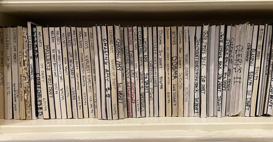 ケヴィン・スミスのインスタグラム：「THE WRITE STUFF! I’m cleaning and organizing my office for the second time during this quarantine and using the day to organize and showcase all of my scripts! @julian.cmo dug four big boxes out of the storage facility so we could make the next edition of the classic screenplay reprints that we publish for #thatkevinsmithclub members every quarter. As I went through everything, I found the basis for my life’s work. Physical media has been replaced by digital media, but as an old school screenwriter from the 90’s, I am in LOVE with the analog look of all the various drafts of my scripts lined up like that. 27 years worth of words are represented in this first pic. Pic 2 depicts floppy disks from my old Smith Corona personal word processor that contain the various drafts of my first three films. The solo floppy disk in Pic 3 reveals an even rarer relic: Before I started calling the flick DOGMA, it was called GOD: THE MOVIE. This disk contains the earliest rumblings of what would one day become my 4th film, started slightly before I finished writing CLERKS. Finding this stuff is like bumping into my favorite friends with whom I spent the most fun and formative years of my life! But it’s also a solid reminder that, while my journey has gone on further and longer than I even dared dream back in my early 20’s, it’s a journey that started with the written word. I’ve been lucky enough to collect a lot of titles over the years (director, actor, podcaster, comedian, TV host, omnipresent asshole) - but if I had to identify myself by only one vocation, it would definitely be Writer. I’m a cat who’s had lots to say his whole life (albeit nothing of any real importance), so words have always determined both my personal and professional worth. And while a writer can be boring (case in point: this long caption), writing is always exciting. Because each time you tap a key, you’re traveling one step further away from how the world is, and one step closer to how the world can be! #KevinSmith #scripts #screenplay #writer #floppydisk」