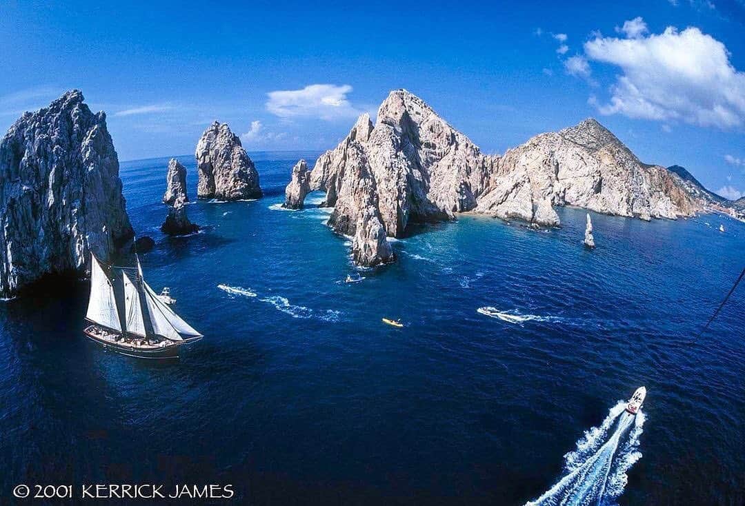 Ricoh Imagingのインスタグラム：「Posted @withregram • @kerrickjames5 Once upon a time you could parasail closer to the classic sea arch at Finisterra, Land’s End, but no more. Shot with the Pentax MZ-S and 17-28mm fisheye zoom on Fuji Provia 100. @pentaxians @pentaxiansunite @ricohpentax」