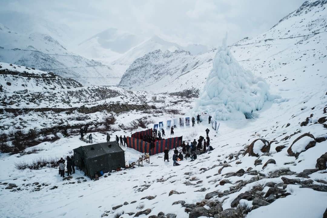 National Geographic Travelさんのインスタグラム写真 - (National Geographic TravelInstagram)「Photo by @ciriljazbec / People gather in Leh for the inauguration of a new stamp cover of the Indian postal service. The stamp cover features Ice Stupas. As snows dwindle and glaciers recede, people in the mountains of northern India are building huge ice cones that provide water into the summer called Ice Stupas. Follow the link at @ciriljazbec to see more.」12月26日 0時37分 - natgeotravel