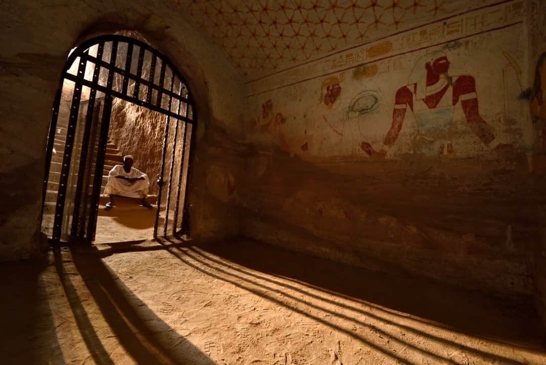 National Geographic Travelさんのインスタグラム写真 - (National Geographic TravelInstagram)「Photo by Robbie Shone @shonephoto / Uncle Ali waits patiently outside the gate of the tomb of the Nubian King Tantamani (Tawentamani) at El Kurru. The tomb is completely decorated with hieroglyphic inscriptions and amazing images of the pharaoh and the gods. Our time was almost up, as the allocated two-hour visit inside these ancient tombs had come to an end. It was such an honor and a privilege to see these ancient burial chambers with my own eyes and have the opportunity to document them.」12月26日 16時39分 - natgeotravel