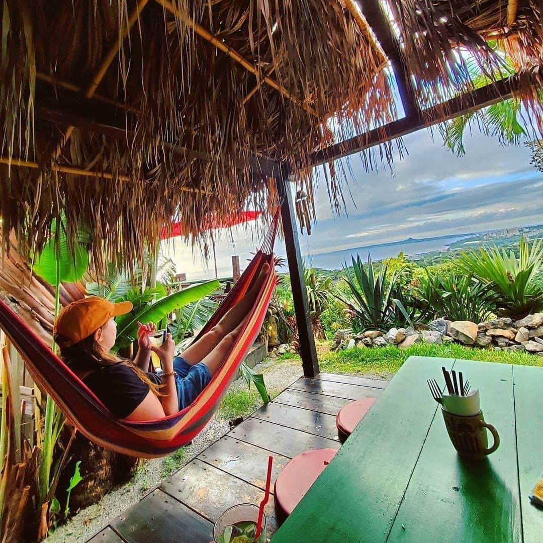 Be.okinawaさんのインスタグラム写真 - (Be.okinawaInstagram)「Nothing better than having a refreshment while resting on a hammock and gazing at the exceptional view of “Tacchu” (Mt. Gusuku in Ie Island)!  📍: Hammock Garden (Annetaichaya)  📷: @meganpicha Thank you very much for your lovely photo!  You can find several cafes with spectacular views in the northern part of Okinawa main island, each with a different ambiance. Find your favorite cafe for delicious food and stunning scenery!  Hold on a little bit longer until the day we can welcome you! Experience the charm of Okinawa at home for now! #okinawaathome #staysafe  Tag your own photos from your past memories in Okinawa with #visitokinawa / #beokinawa to give us permission to repost!  #ハンモック #hammock #本部町 #motobu #모토부 #motobutown #絶景カフェ #美景 #japan #travelgram #instatravel #okinawa #doyoutravel #japan_of_insta #passportready #japantrip #traveldestination #okinawajapan #okinawatrip #沖縄 #沖繩 #오키나와 #旅行 #여행 #打卡 #여행스타그램」12月26日 19時00分 - visitokinawajapan