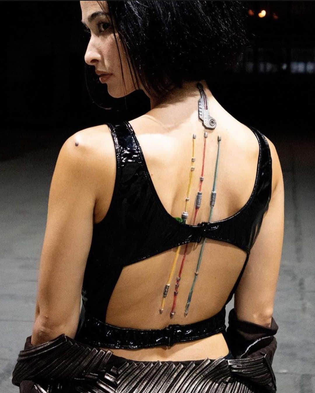 メロディー洋子のインスタグラム：「Behind the scenes from the amazing and fantastically fun debut music video shoot for @recursiveresonance [SIMULACRON]  @storymode.film  Director: @allysasing  DP: @harabek  VFX Sup: @jamesonsonson  Hair & Make up & Prosthetics: @applelove_makeup   Thank you to the incredible team for creating such a spectacular world to run around in. 🙏  Thank you to Apple who transformed me into a badass.   Finally, I am officially an Android.   If this life was a simulation, would you do it all over again? I know I would.   Check out the full video on @recursiveresonance YouTube or link in their bio.   サイバーパンクなMV！最高に楽しい収録でした。フルビデオはYouTubeをチェックしてね！　🤖✨😄🖤  #bts #musicvideo #cyberpunk #android #actress #badass #recursiveresonance #simulacron」