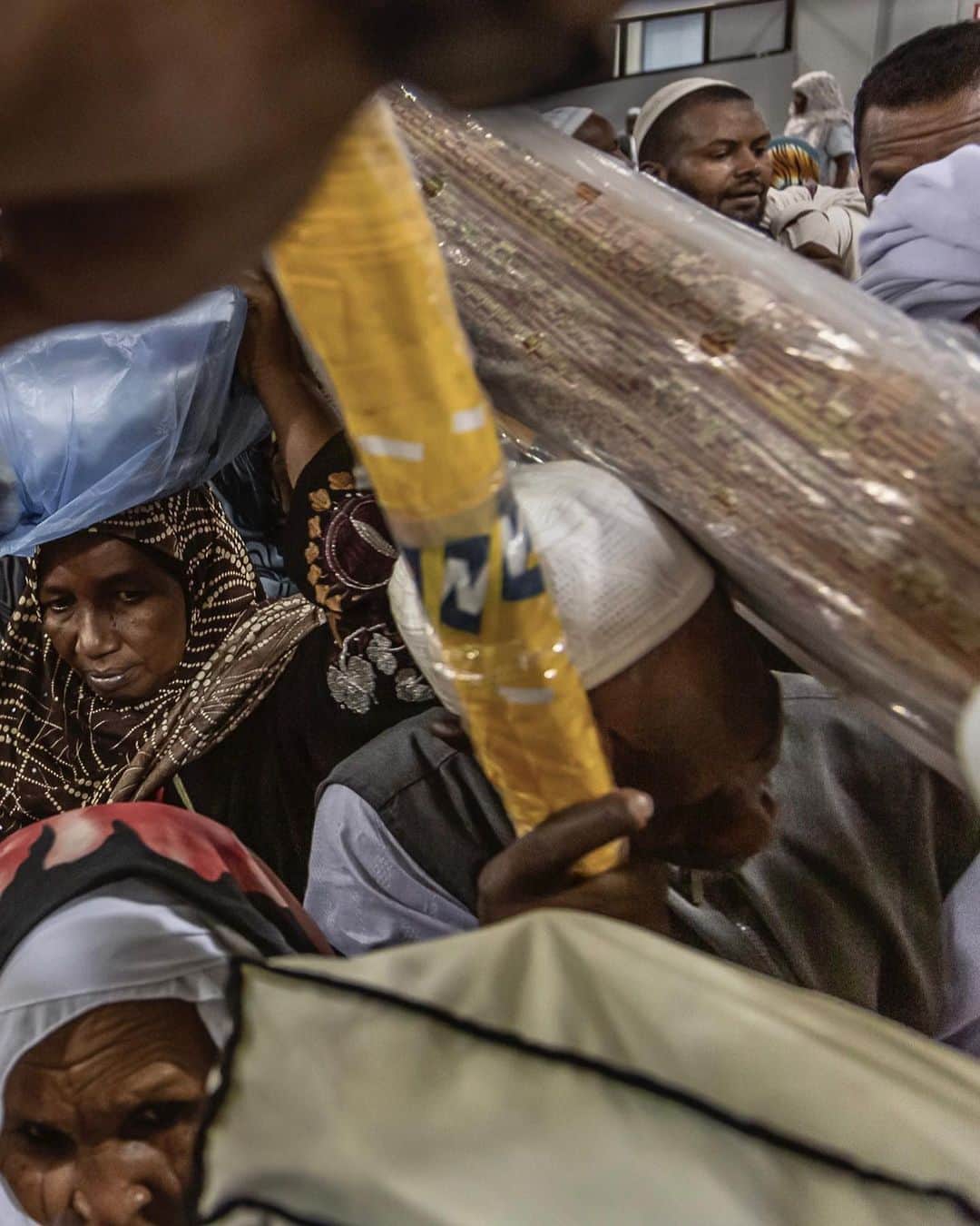 ジョン・スタンメイヤーさんのインスタグラム写真 - (ジョン・スタンメイヤーInstagram)「In recent days, I’m feeling a bit this way, tonight sharing chaos on a humanity scale…Saudi Immigration officers attempt in organizing a line to stamp passports before Sudanese women and men board a boat for Port Sudan, one of near uncountable ships departing each day from Jeddah Islamic Port at the end of Haj visit to Mecca. ⠀⠀⠀⠀⠀⠀⠀ from the @natgeo story #TheWellsOfMemory @outofedenwalk #SaudiArabia #immigration #jeddahislamicport #sudanese #endofhaj #chaos #fromthearchives」12月30日 11時26分 - johnstanmeyer