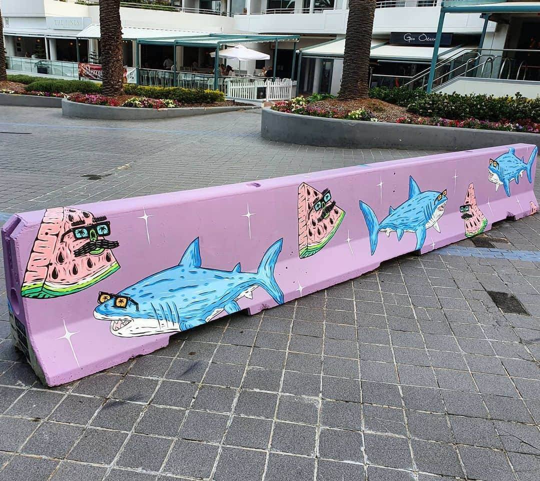 MULGAさんのインスタグラム写真 - (MULGAInstagram)「Another traffic barricade I painted down at Nulla Beach.⁣ ⁣ The story of Watermelon Wally 🍉 and Shannasy the Shark 🦈 ⁣ ⁣ Once there was a shark called Shannasy and he was a big fan of watermelon and anytime he would see some watermelon he would eat it ferociously but then one day as he was about to eat a fresh piece of watermelon it talked to him and said "How ya goin mate?" and the piece of watermelon was Watermelon Wally one of the most famous's watermelons in Cronulla. They got to know each other and became good friends and often went and had lunch at the Noodle Inn together and Shannasy stopped eating watermelon in honour of his new friend Wally the Watermelon. ⁣ ⁣ The End⁣ ⁣ #mulgatheartist #muralart #shark #sharkart #watermelonart #watermelonart #cronulla #cronullabeach #streetart #muralart #sydneystreetart」12月31日 5時35分 - mulgatheartist