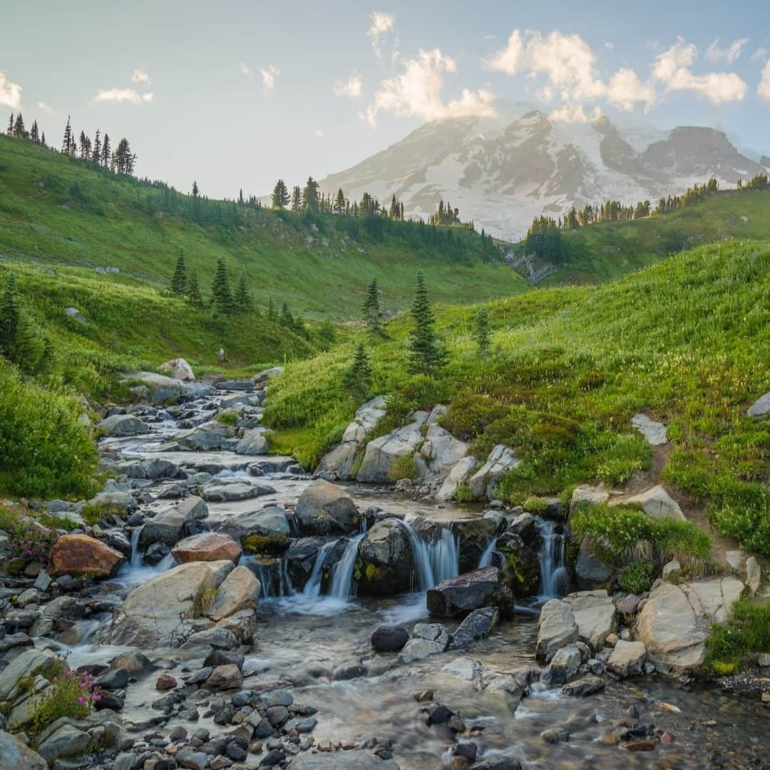 アメリカ内務省さんのインスタグラム写真 - (アメリカ内務省Instagram)「Welcome to Paradise. Located on the south side of Mount Rainier National Park in #Washington, the area features stunning scenery, #waterfalls and subalpine #meadows. The second you reach the parking lot, you're overwhelmed with epic mountain views. The rolling, verdant mountainside along the Myrtle Falls trail provides plenty of opportunities for #photographs and places to pause and process the beauty. At these higher elevations, it's always good to prepare for winter conditions, be flexible with your plans and follow the safety measures that the park recommends. Photo @MountRainierNPS by Kristopher Schoenleber (www.sharetheexperience.org).  #ICYMI We're looking back on the favorite posts of 2020 and the list wouldn't be complete without a shot from Paradise  #usinterior  #Top10of2020」12月31日 1時03分 - usinterior