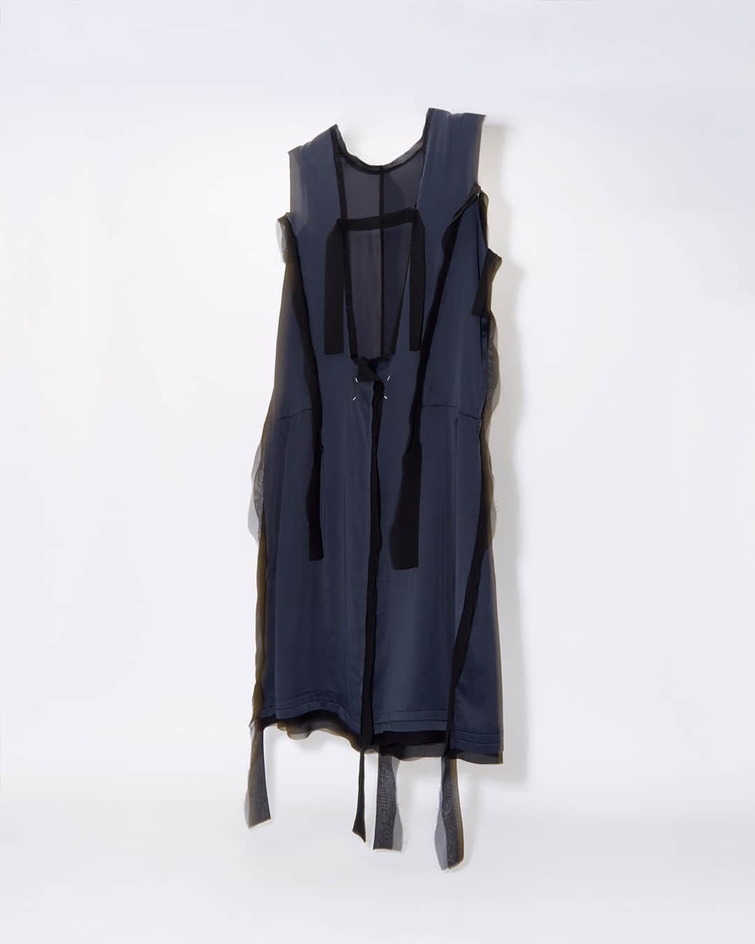 エルエヌシーシーのインスタグラム：「Combining a conceptual vision with an iconoclast heritage, Maison Margiela’s Panelled Dress is crafted from a satin weave, featuring contrast georgette panels.  Explore new season pieces from @maisonmargiela」