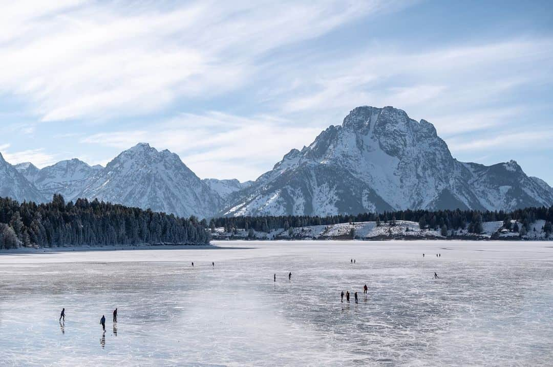 National Geographic Travelさんのインスタグラム写真 - (National Geographic TravelInstagram)「Photos and videos by @taylorglenn / In early December the conditions lined up just right, creating a very rare opportunity to glide across a frozen Jackson Lake in Grand Teton National Park. Ice skating is certainly common in Wyoming during the winter months but not so much here. One old-timer we met on the ice said he figured it was at least 20 years ago that he remembered this happening. It was a magical experience sliding around with friends and one I will never forget. Swipe through the gallery for more from this incredible evening on the ice. Follow @taylorglenn for more from #Wyoming and beyond. #grandtetonnationalpark #iceskating #iceskater」1月1日 2時49分 - natgeotravel