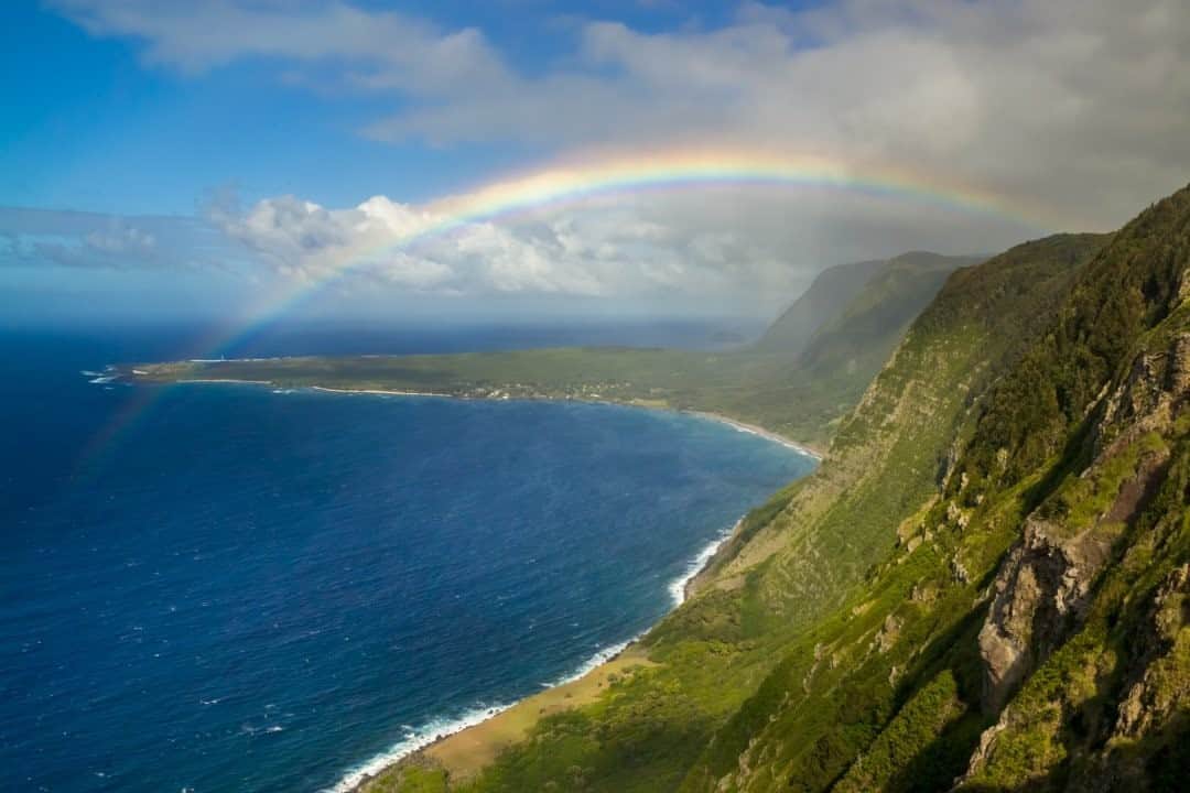 National Geographic Travelさんのインスタグラム写真 - (National Geographic TravelInstagram)「Photo by @jonathankingston / Kalaupapa National Historical Park, Molokai, Hawaii. The remoteness and relative isolation of the Kalaupapa Peninsula is why the Kingdom of Hawaii designated it as a quarantine site to isolate patients suffering from Hansen’s disease (commonly known as leprosy) in 1865. The rainbow, a symbol of hope and rebirth, is the perfect representation of all that Kalaupapa has become, because ultimately it is the story of hope and rebirth in the face of crushing odds. Of science triumphing over disease and human spirit triumphing over bleakness. In the face of brutal, lifetime quarantines, the patients of the settlement created a community that has inspired me during my own COVID lockdowns and physical isolation from friends and family.   I would have never guessed this image would end up in a @natgeo story when I pressed the shutter in 2006. My first assignment for National Geographic didn’t happen until 2008 and the thought of pursuing a story on Kalaupapa didn’t cross my mind until 2013. Fittingly, one of the first images I took of Kalaupapa is the shot that closes the story.  What has given you inspiration during your COVID lockdowns?  For more images from the Kalaupapa story, follow @jonathankingston. #quarantine #hansensdisease #kalaupapa #hawaii #rainbow」1月3日 12時34分 - natgeotravel