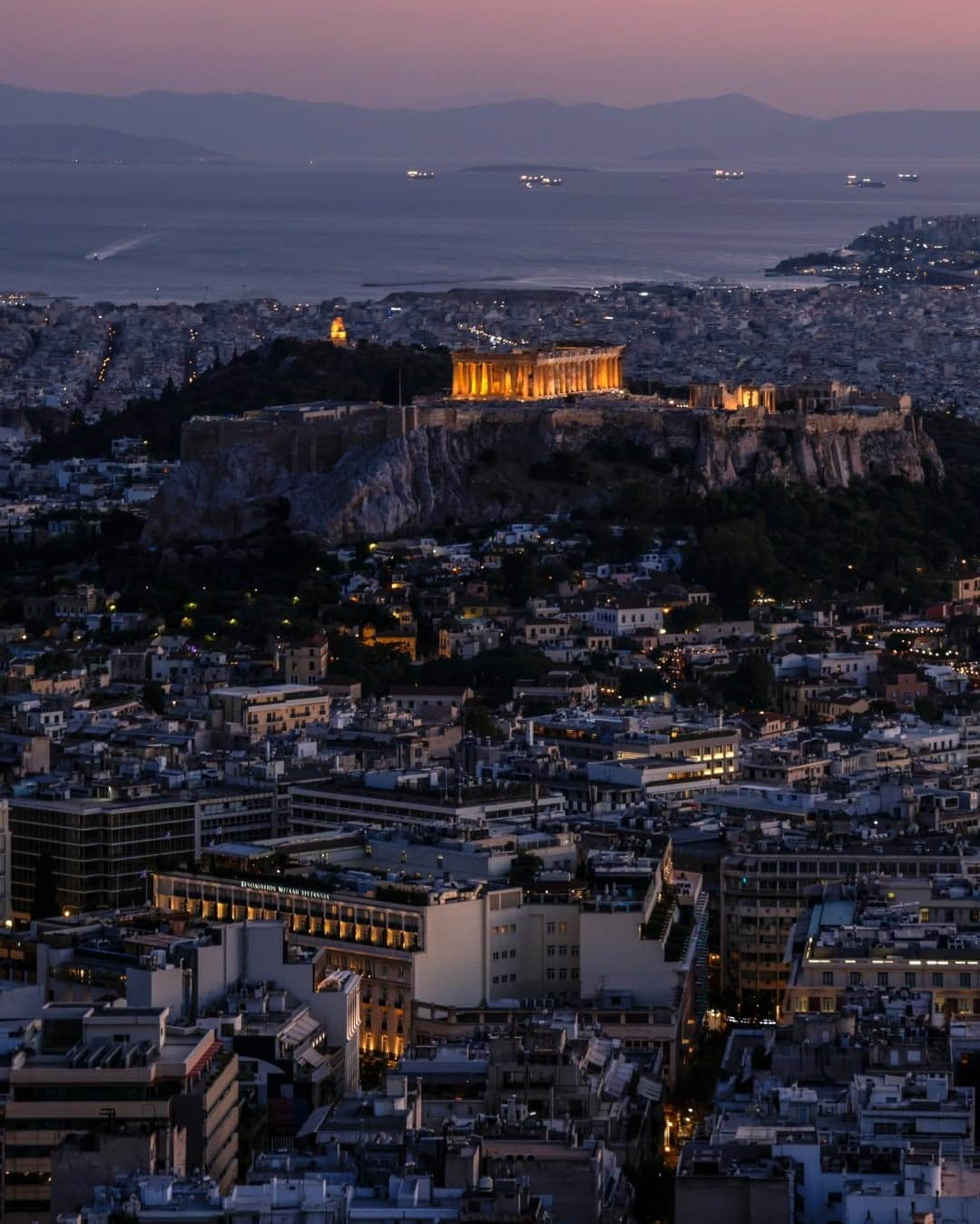 National Geographic Travelさんのインスタグラム写真 - (National Geographic TravelInstagram)「Photo by Muhammed Muheisen @mmuheisen / The fifth-century B.C. Parthenon temple is illuminated atop the ancient Acropolis, with the Saronic Gulf seen in the background, in Athens, Greece. For more photos and videos from different parts of the world, follow me @mmuheisen and @mmuheisenpublic. #muhammedmuheisen #Greece #Athens #Acropolis」1月3日 16時39分 - natgeotravel