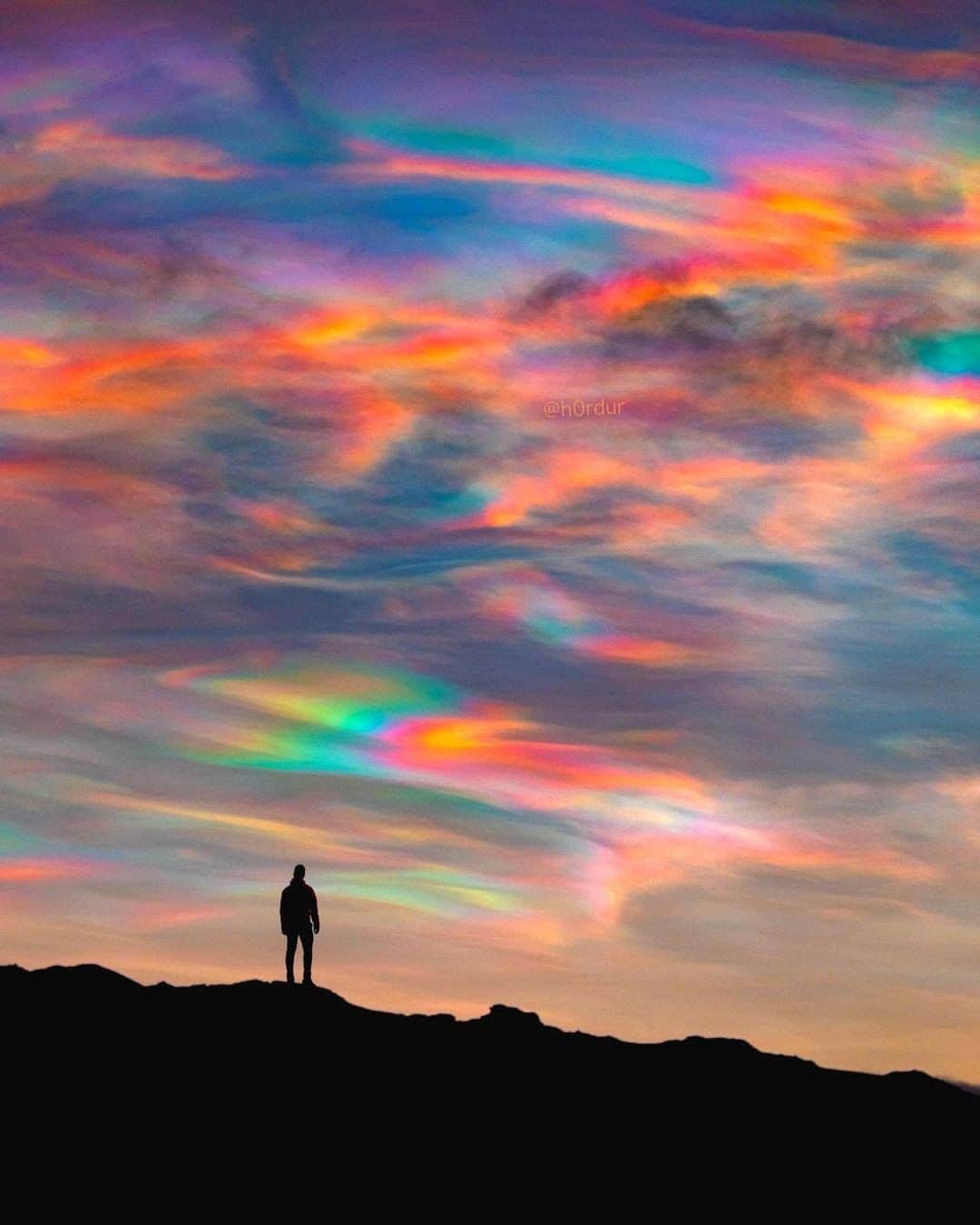 Discover Earthさんのインスタグラム写真 - (Discover EarthInstagram)「Who's ever seen such a beautiful sky? Polar stratospheric clouds (PSCs) are clouds in the winter polar stratosphere at altitudes of 15,000–25,000 m (49,000–82,000 ft). They are best observed during civil twilight, when the Sun is between 1 and 6 degrees below the horizon, as well as in winter and in more northerly latitudes.  "Experienced some of the most incredible polar stratospheric clouds I’ve ever seen in my life few days ago (also called nacreous clouds). The sun was rising so the orange glow blended with those unbelievable rainbow clouds. Polar stratospheric clouds are rare and only form in the Arctic polar region."  #discovericeland🇮🇸 with @h0rdur   . . . . . .  #iceland  #everydayiceland  #igersiceland  #inspiredbyiceland  #icelandair  #wheniniceland  #reykjavik  #mystopover  #ig_iceland  #icelandtravel  #visiticeland  #icelandic  #whyiceland  #exploreiceland  #discovericeland  #aroundiceland  #unlimitediceland  #ísland  #icelandsecret  #loves_iceland  #wowair  #icelandexplored  #alliceland  #islandia  #bestoficeland  #absoluteiceland  #northernlights  #icelandtrip  #waterfall」1月5日 0時00分 - discoverearth