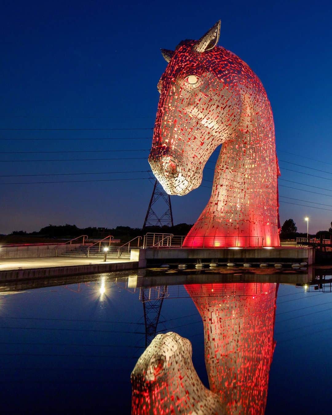 National Geographic Travelさんのインスタグラム写真 - (National Geographic TravelInstagram)「Photo by @jimrichardsonng / In Scottish lore kelpies are shape-shifting creatures that come out of the sea, emerging as monstrous big horses, a hundred times bigger and stronger than any known horse. But “The Kelpies” at Falkirk are no myth. A hundred feet high, these stainless steel sculptures by Andy Scott blaze red (and other colors) in the night. Many Scottish streams and lochs have their own kelpie story to rival Loch Ness and its monster. For more Scotland follow @JimRichardsonNG.」1月5日 0時39分 - natgeotravel