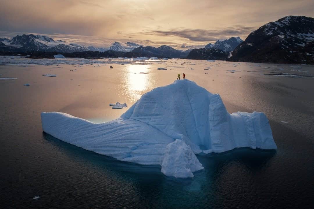 National Geographic Travelさんのインスタグラム写真 - (National Geographic TravelInstagram)「Photo By Keith Ladzinski @ladzinski / After being stuck in sea ice for well over a week, professional climbers Mike Libecki and Ethan Pringle decided to shake off the cobwebs and climb this iceberg to take in the view of open water at sunset. I shot this aerial as we were making our way to a remote fjord in southeast Greenland on a day-climbing expedition. It took us 11 days in total to simply arrive, a not uncommon occurrence in the early summer months here. Moments like this made the restlessness of our passage melt away, as we took in the endless and raw beauty of the remote Arctic that is tucked away in our planet’s most remote regions.」1月5日 12時35分 - natgeotravel