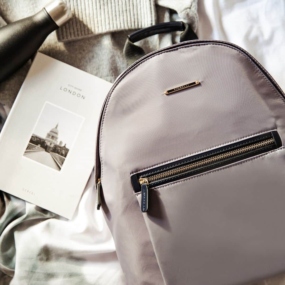 のインスタグラム：「A staple and versatile accessory is found in the Sarah backpack. Crafted in a durable nylon fabric in an understated storm colourway, this silhouette is designed with multiple fastenings for prime practicality. Was £59, now only £23.60 🙌 #FiorelliBags #Backpack」