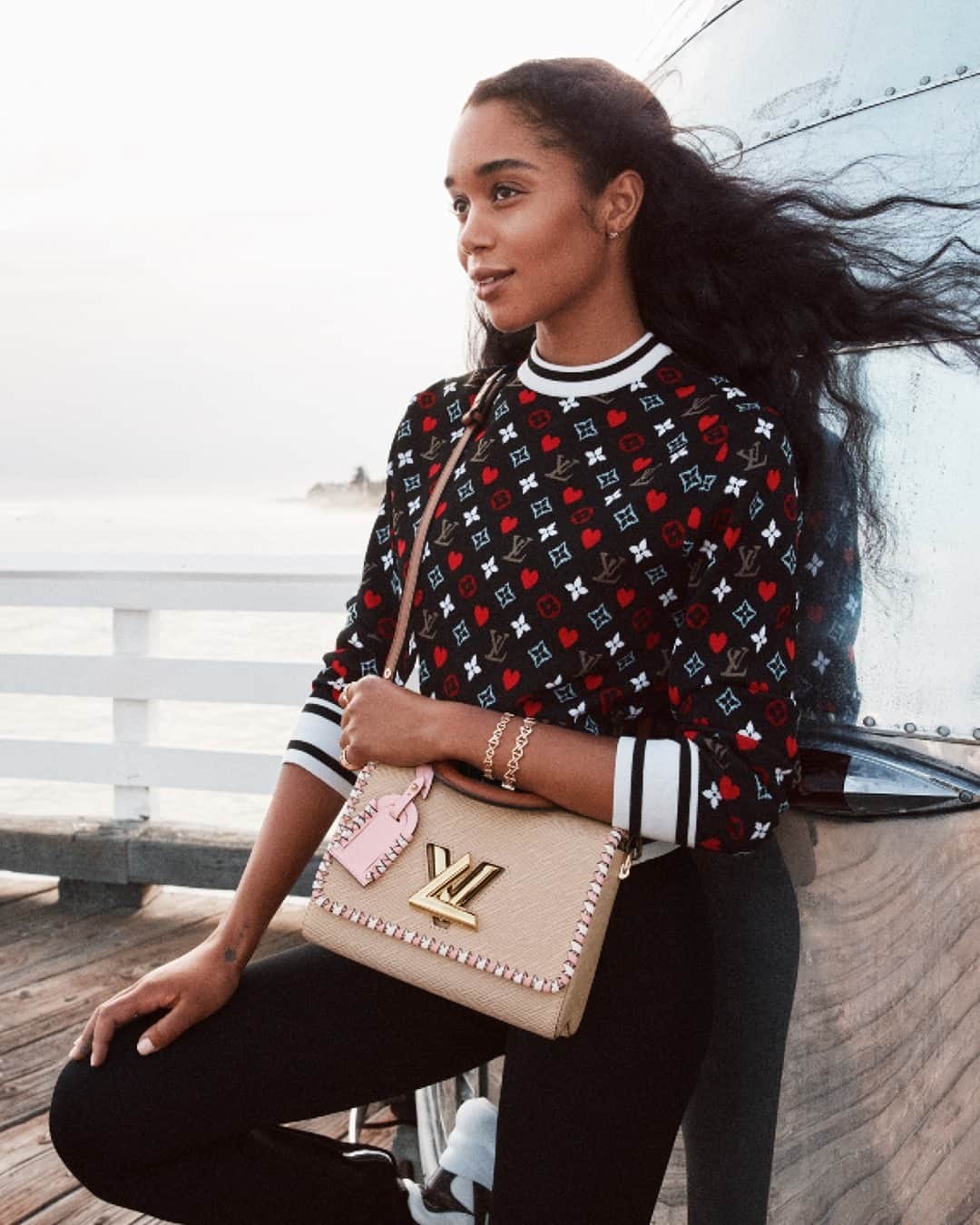 のインスタグラム：「Spring awakening. Enjoying the light sea breeze, @LauraHarrier wears this season’s Twist with delicate pink and white braided detail. Explore the new #LouisVuitton campaign via link in bio.」