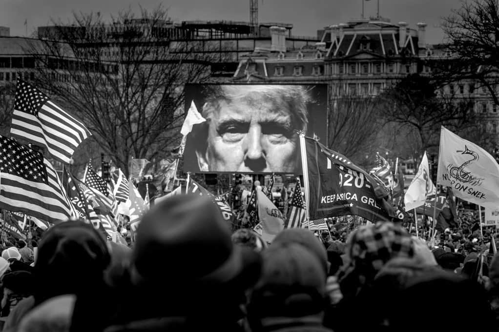 National Geographic Creativeのインスタグラム：「Photo by @nina_berman / President Trump's image appears on a screen at a rally outside the White House yesterday, the day set for ratifying President-elect Joe Biden’s electoral college victory in the 2020 election. Later, a mob of his supporters stormed the Capitol building, prompting a lockdown and an evacuation of lawmakers. After the building was cleared, the Senate resumed the electoral count.」