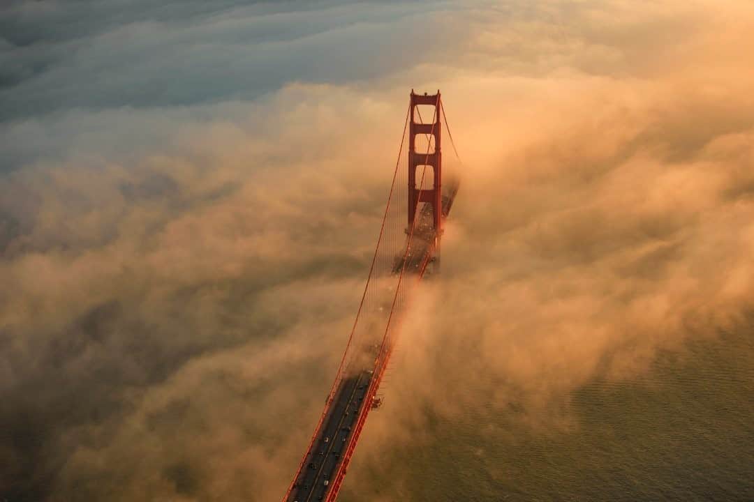 National Geographic Travelさんのインスタグラム写真 - (National Geographic TravelInstagram)「Photo by Jassen Todorov @jassensf / Fog hangs over the Golden Gate Bridge last February. It is unusual to have such a low coastal fog during the winter season in San Francisco. I clearly remember that day. I spent several hours practicing my violin in preparation for concerts and recordings. After all, 2020 was supposed to be an important year, as the world was just getting ready to celebrate 250 years since Beethoven’s birth. I kept an eye on the fog during my practice, hoping it would not dissipate before the golden hour. As soon as I got airborne, I realized it would be one of those special and unforgettable days. I circled over the city and the Golden Gate Bridge a few times, trying to capture the magic that was unfolding in front of my eyes.  Congratulations to Jassen Todorov on becoming the 2020 Your Shot Photographer of the Year! Jassen will be the guest editor for the #NatGeoYearInPictures hashtag challenge.  Last year tested us, isolated us, and empowered us. It was also a year when hope endured. What did 2020 look like to you? Can you show us? Upload your images to your feed and use the hashtag #NatGeoYearInPictures. I’ll be curating submissions and featuring my favorites on the Your Shot account. #YourShotPhotographer」1月8日 20時38分 - natgeotravel