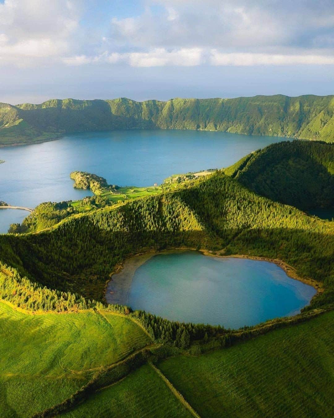 Discover Earthさんのインスタグラム写真 - (Discover EarthInstagram)「The Azores Islands, off the coast in the Atlantic Ocean, may be the best summer destination. Mountains, coastline and lake-filled caldera, there’s plenty to keep even the most ambitious traveller busy.  Who would you like to visit those islands with?  📌 The Azores, Portugal 🇵🇹⁣  #discoverportugal🇵🇹 with @chelseytravels  @brunoazera @followthesuntravel  @charlome_malin  and @johan_drone_adventures   . . . . .  #azores  #acores  #saomiguel  #estoril  #açores  #shzzz_hub  #worldtourists  #unescoworldheritage  #aplacetoremember  #luxwt  #unesco  #forbestravelguide  #awesomedreamplaces  #streetview」1月9日 0時00分 - discoverearth