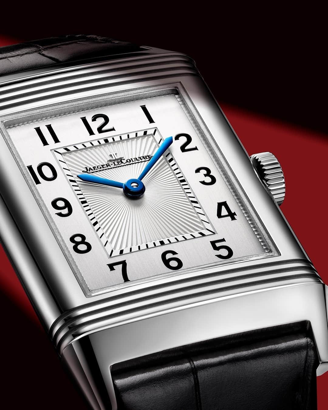 ジャガールクルトのインスタグラム：「Reverso, the echo of time. #Reverso _ Reverso Classic Medium Thin _ Timeless in its face through the pure lines of its steel case surrounded by three emblematic gadroons, highlighted by an Art Deco-inspired guilloché etching, and a silvered face with vertical satin-brushed. Could it be the gift of a lifetime?  _ #JaegerLeCoultre #Reverso #JLCGift #ValentinesDay #Style #ArtDeco #Icon #HomeofFineWatchmaking #SwissWatch #ValleeDeJoux #Watchmaking #Craftsmanship #SavoirFaire」